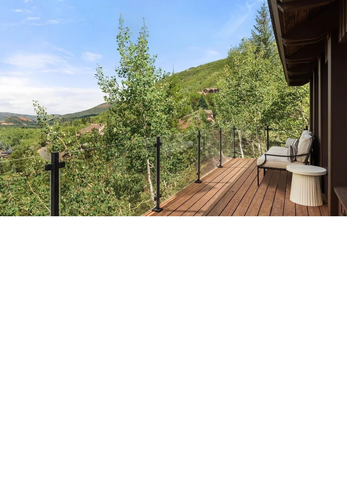 Private mountain-view balcony with serene forest surroundings
