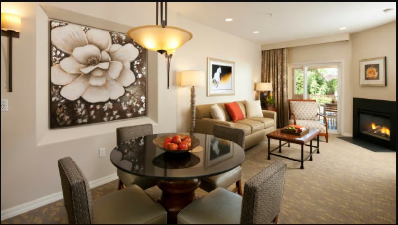 Inviting living area with fireplace, dining space, and natural light