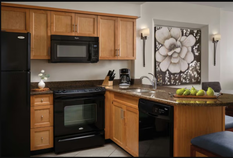 Warm, fully equipped kitchen with breakfast bar and stylish finishes