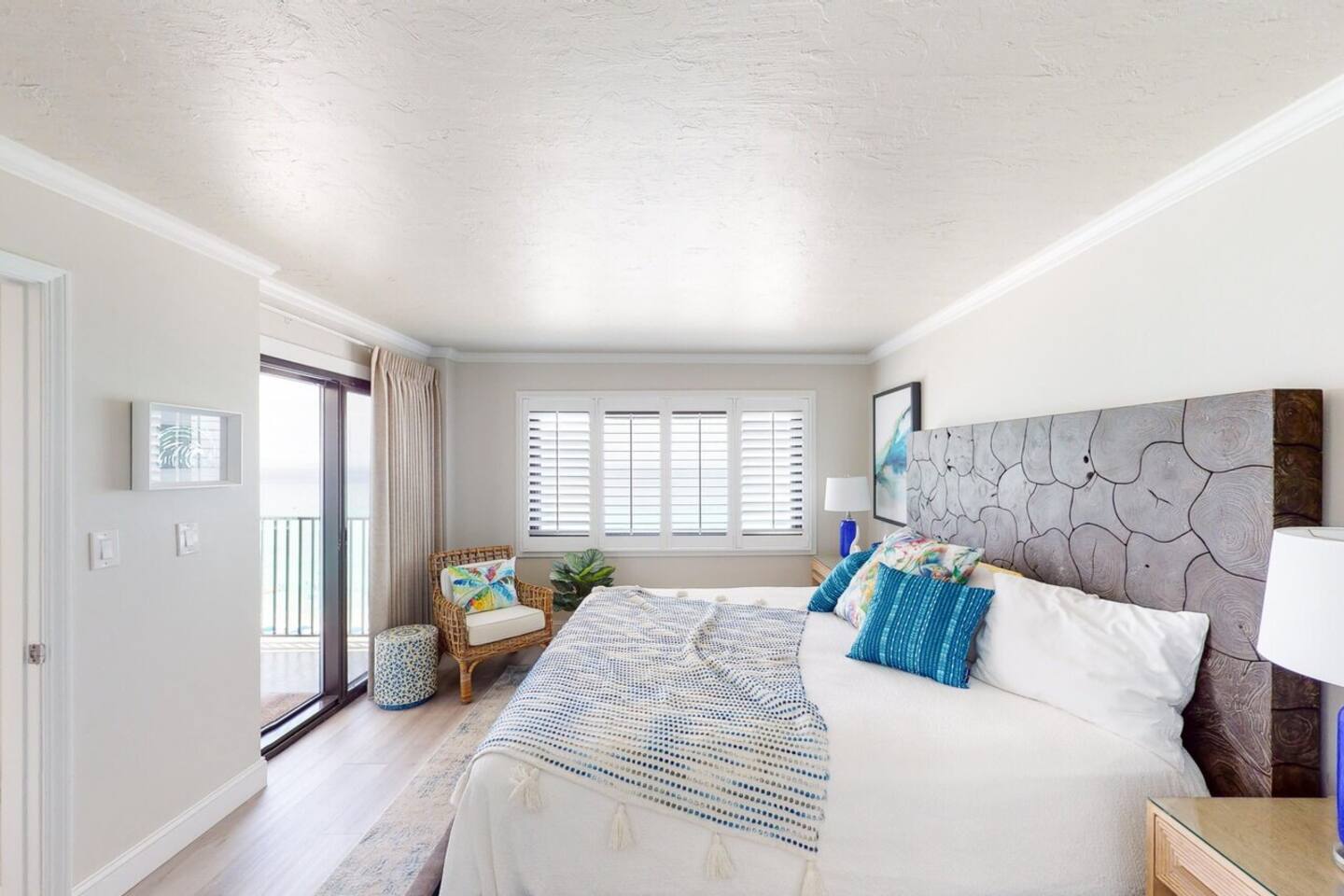 Master Bedroom King with Balcony Access. Wake up to soft wave action and enjoy your morning coffee.