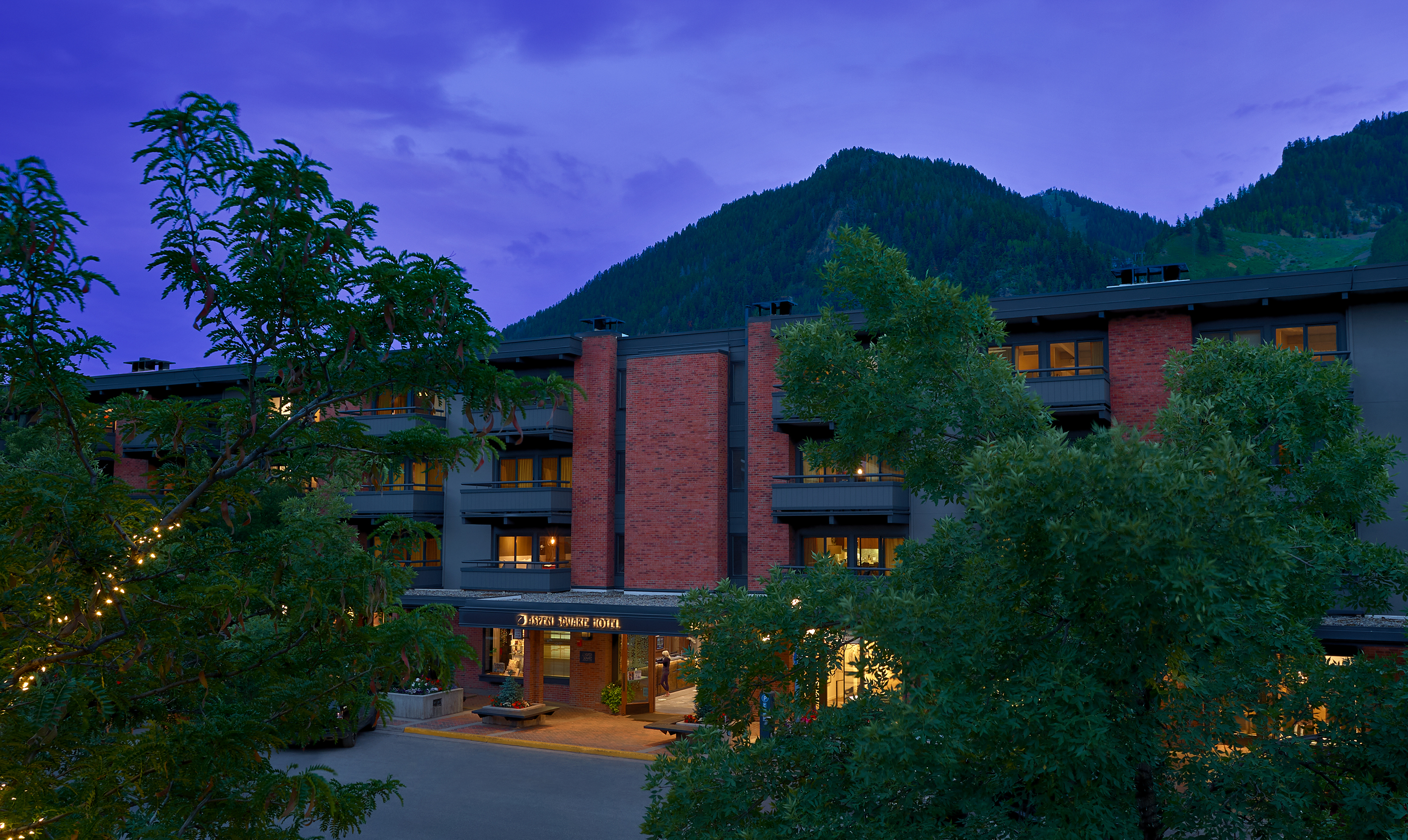 Welcoming mountain retreat with warm lights and scenic alpine views