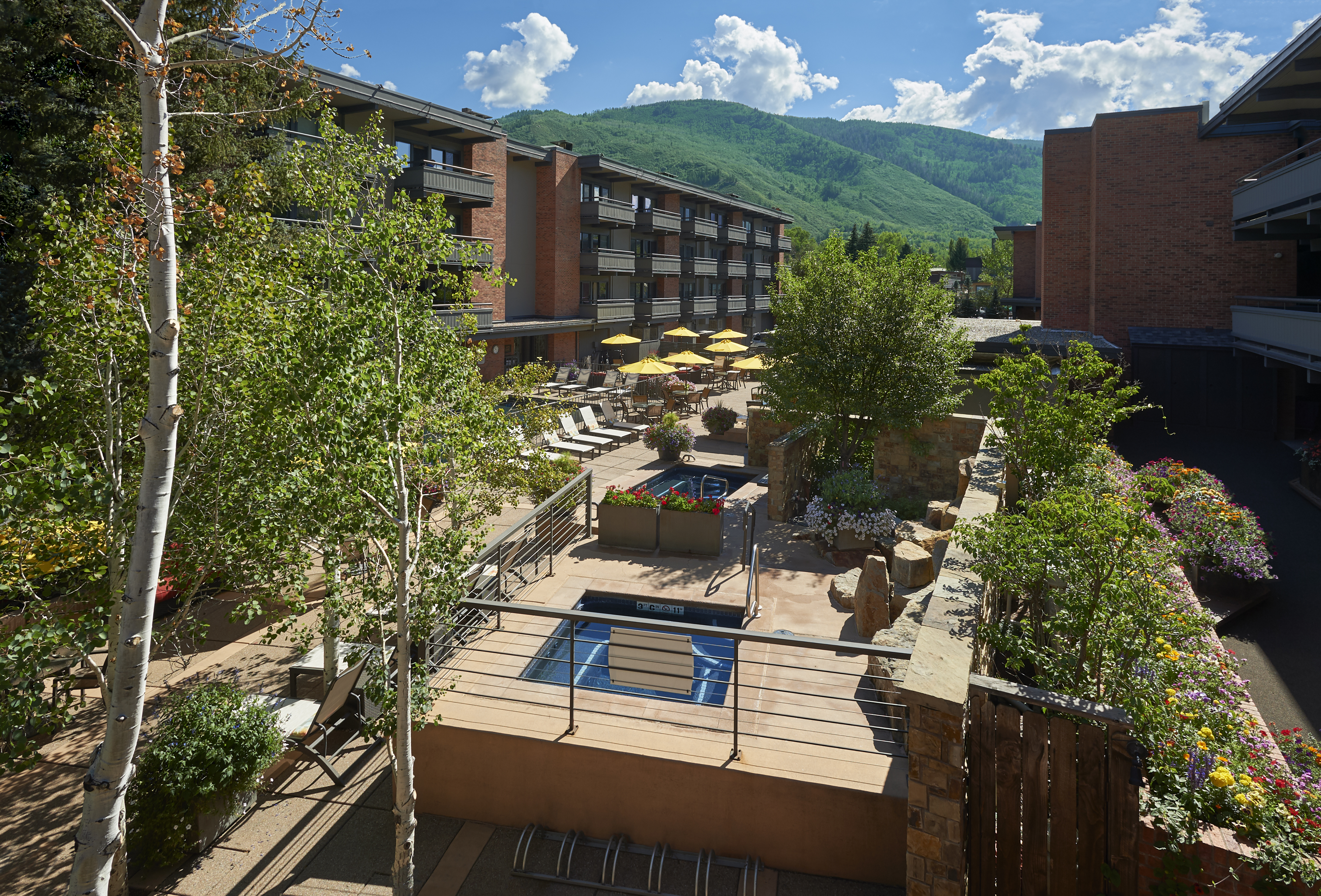 Scenic mountain-view courtyard with lounge seating and resort-style charm