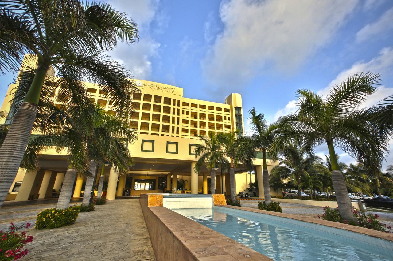 Grand palm-lined entrance with a resort-style welcome