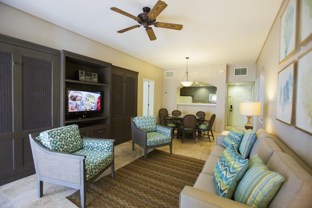 Spacious living area with dining space, TV, and inviting coastal-style decor