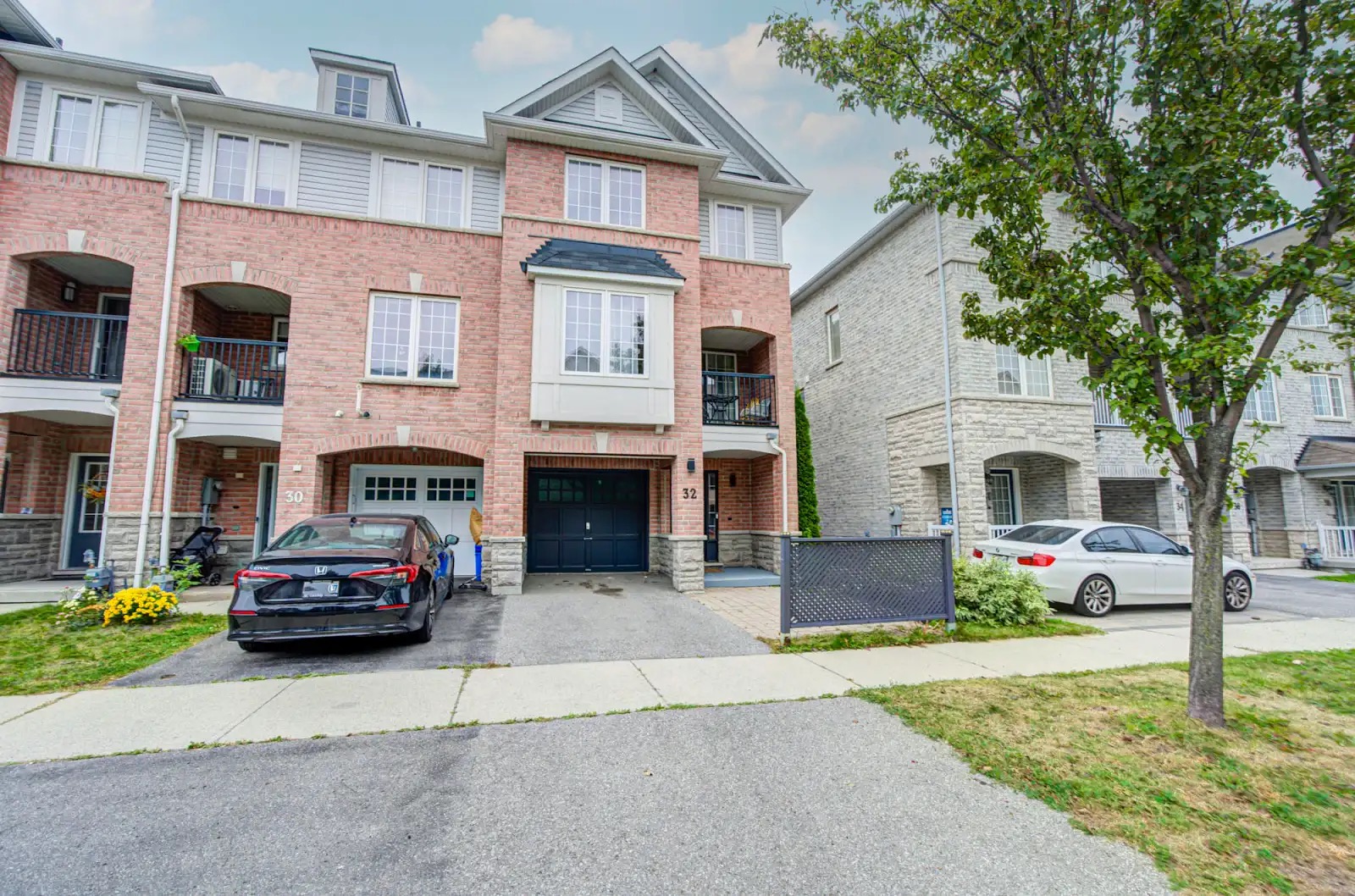 Modern brick townhouse with private driveway in a quiet neighborhood