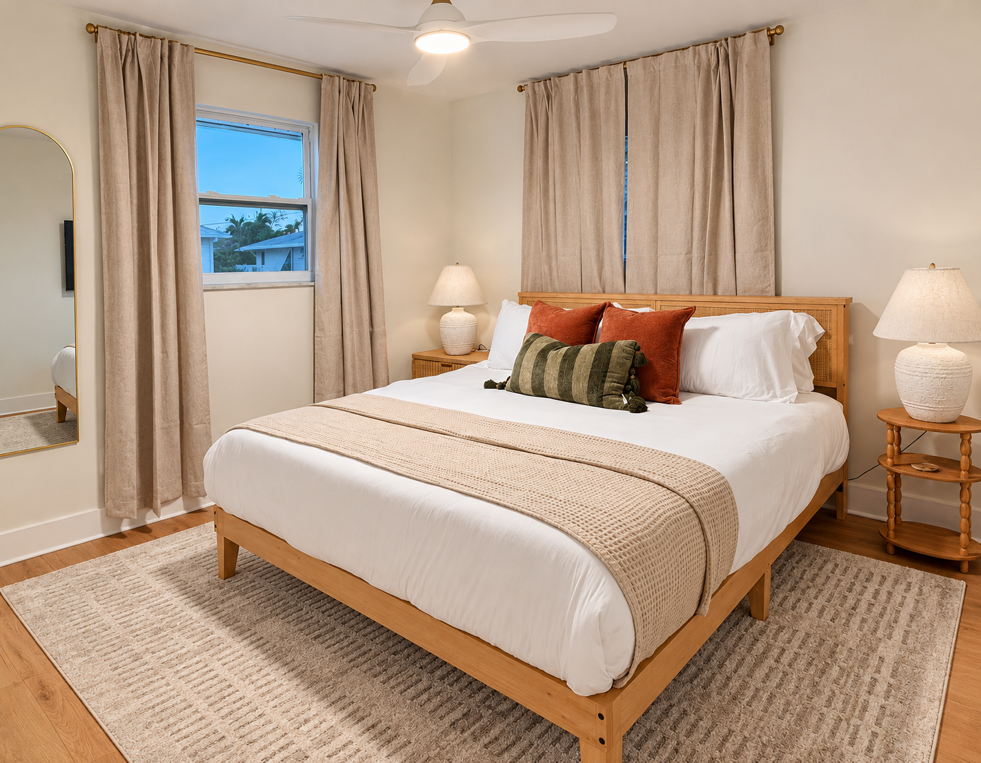 Cozy, stylish bedroom with plush linens and warm modern touches