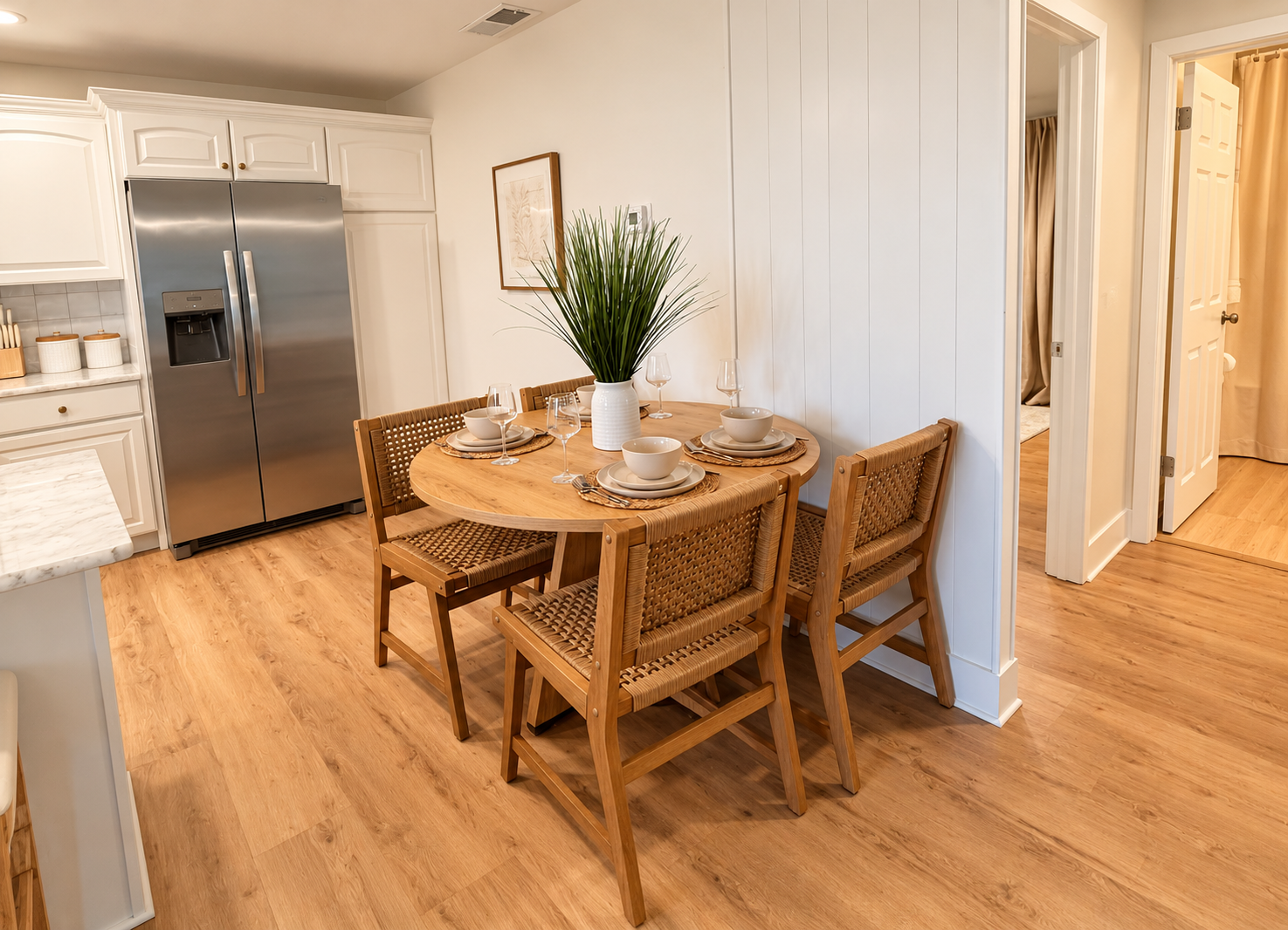 Bright dining nook for 4 beside a stylish modern kitchen
