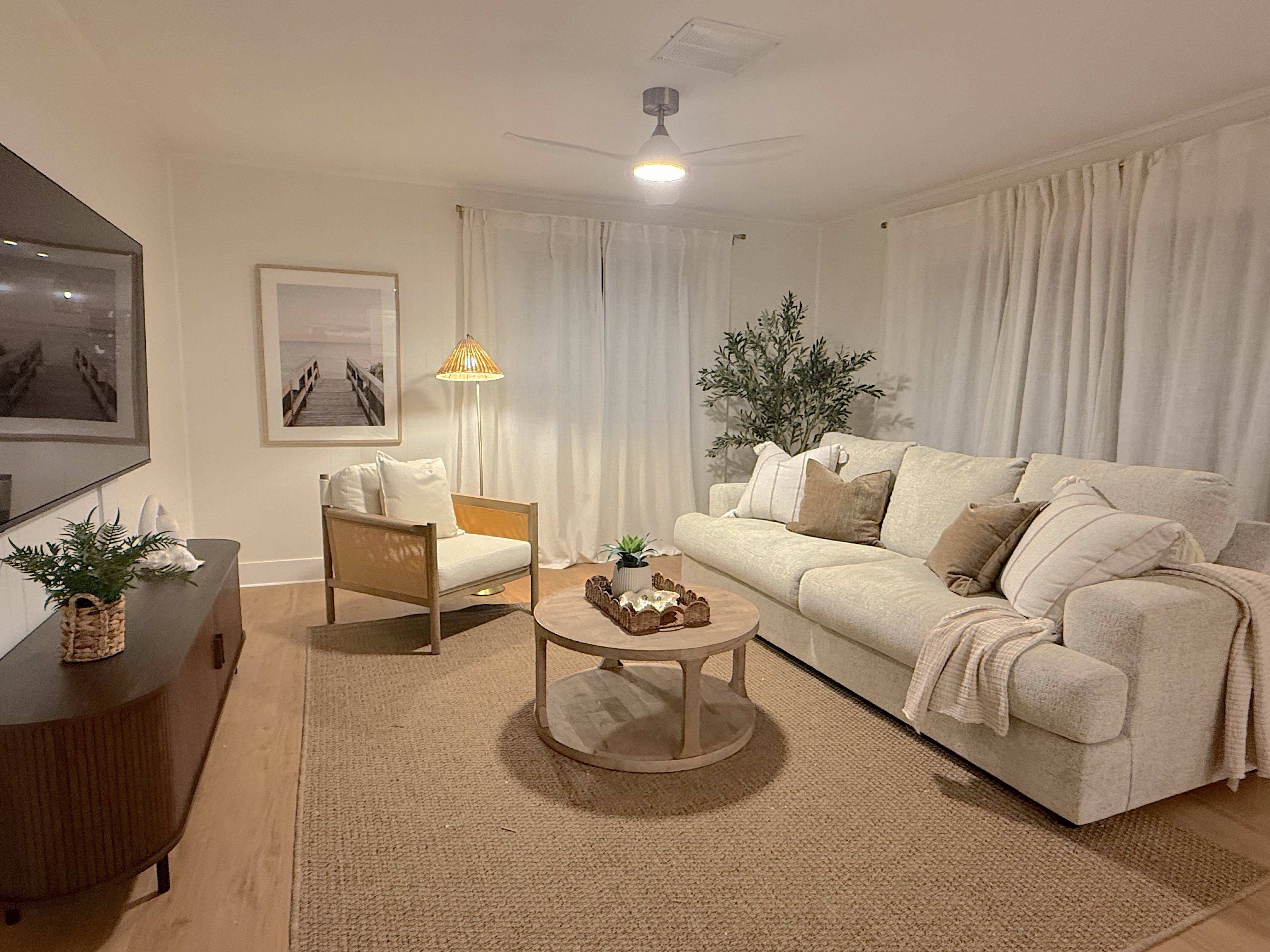 Bright, cozy living room with plush seating and warm coastal style