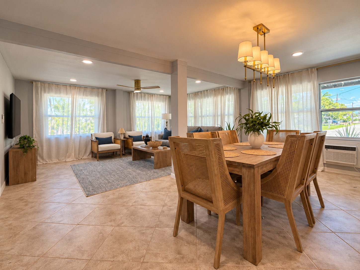 Bright open living and dining space with natural light and stylish seating