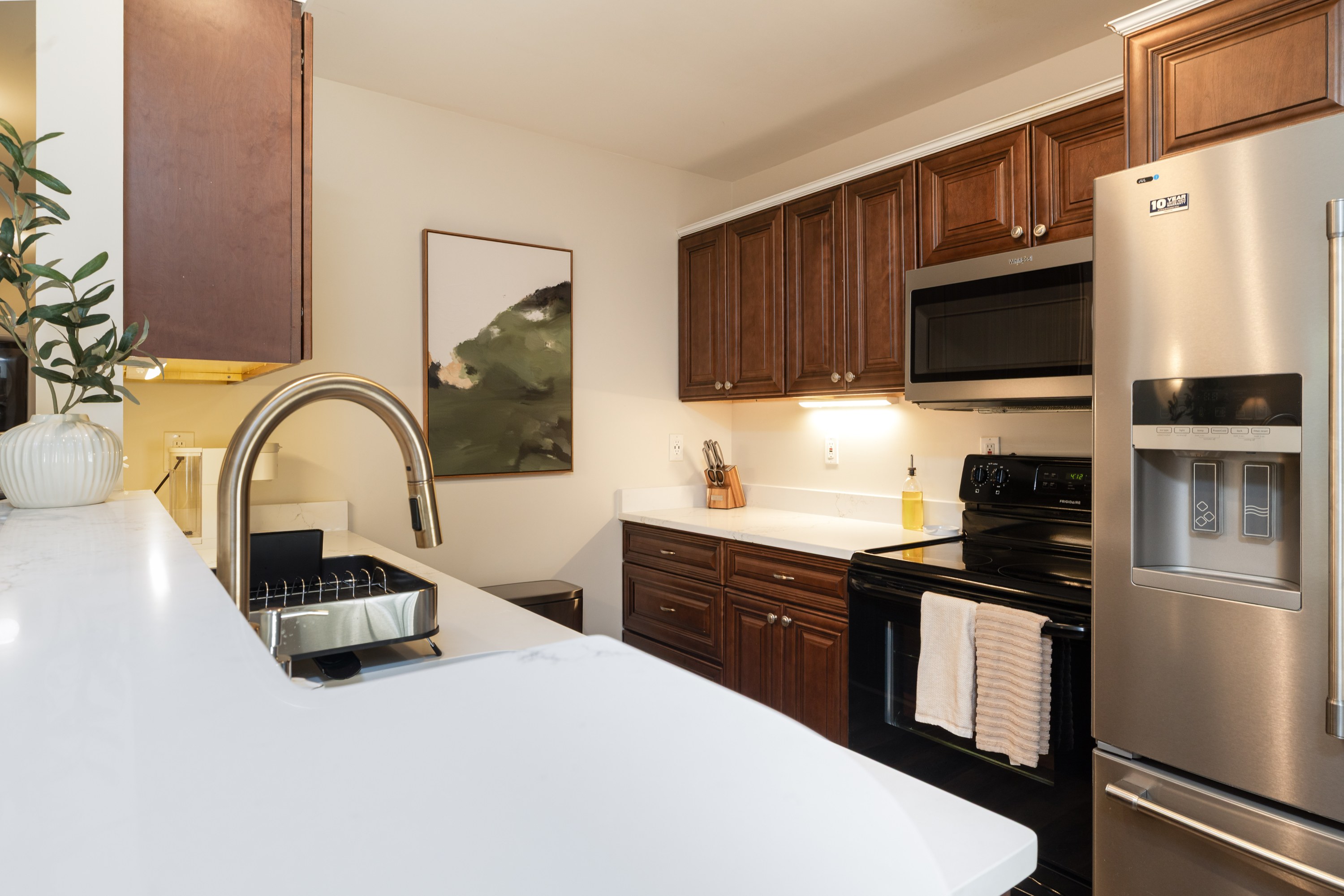 Kitchen sink and counter with under-cabinet lighting