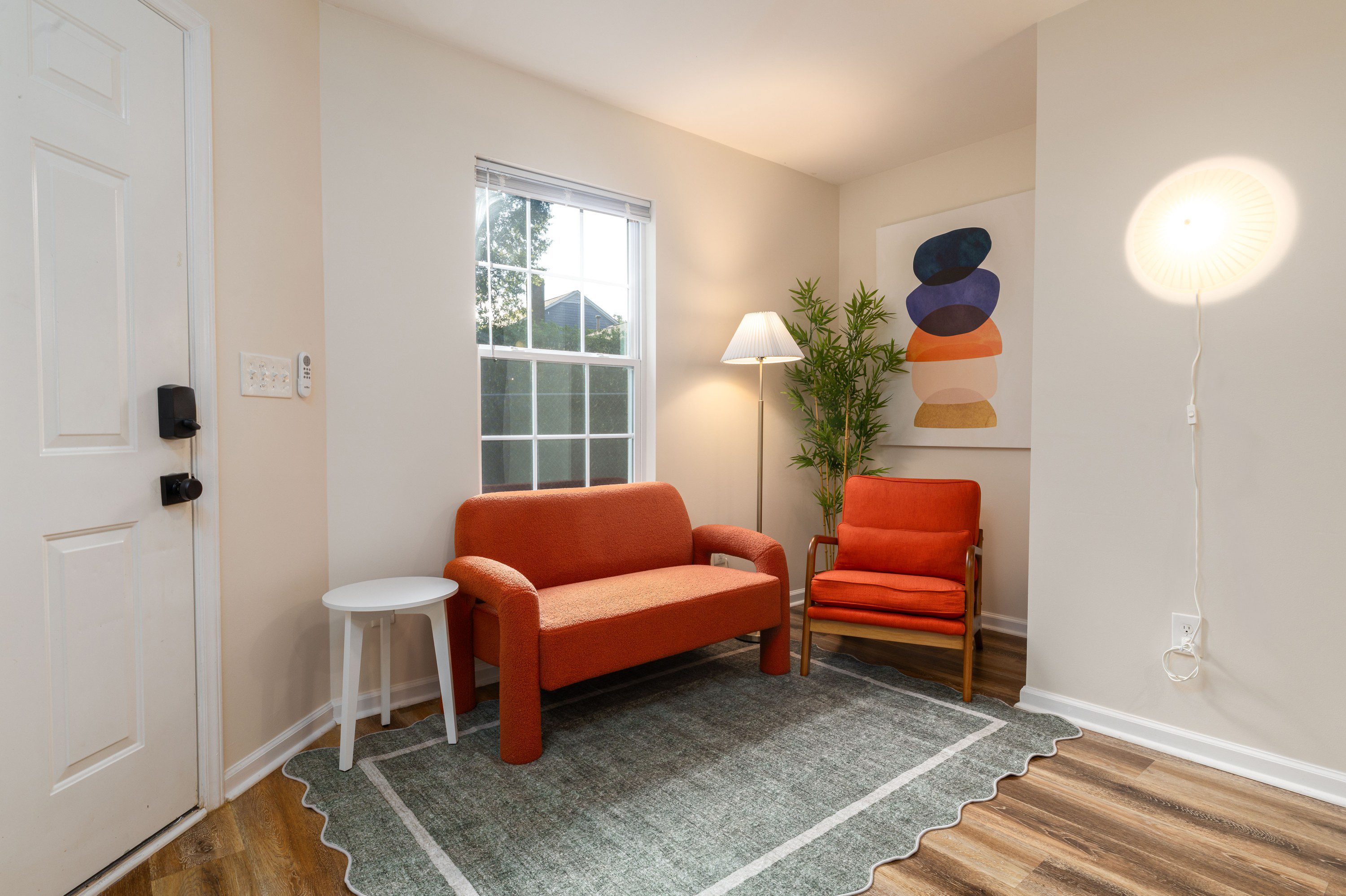 Living room just inside the front door, with its keypad lock