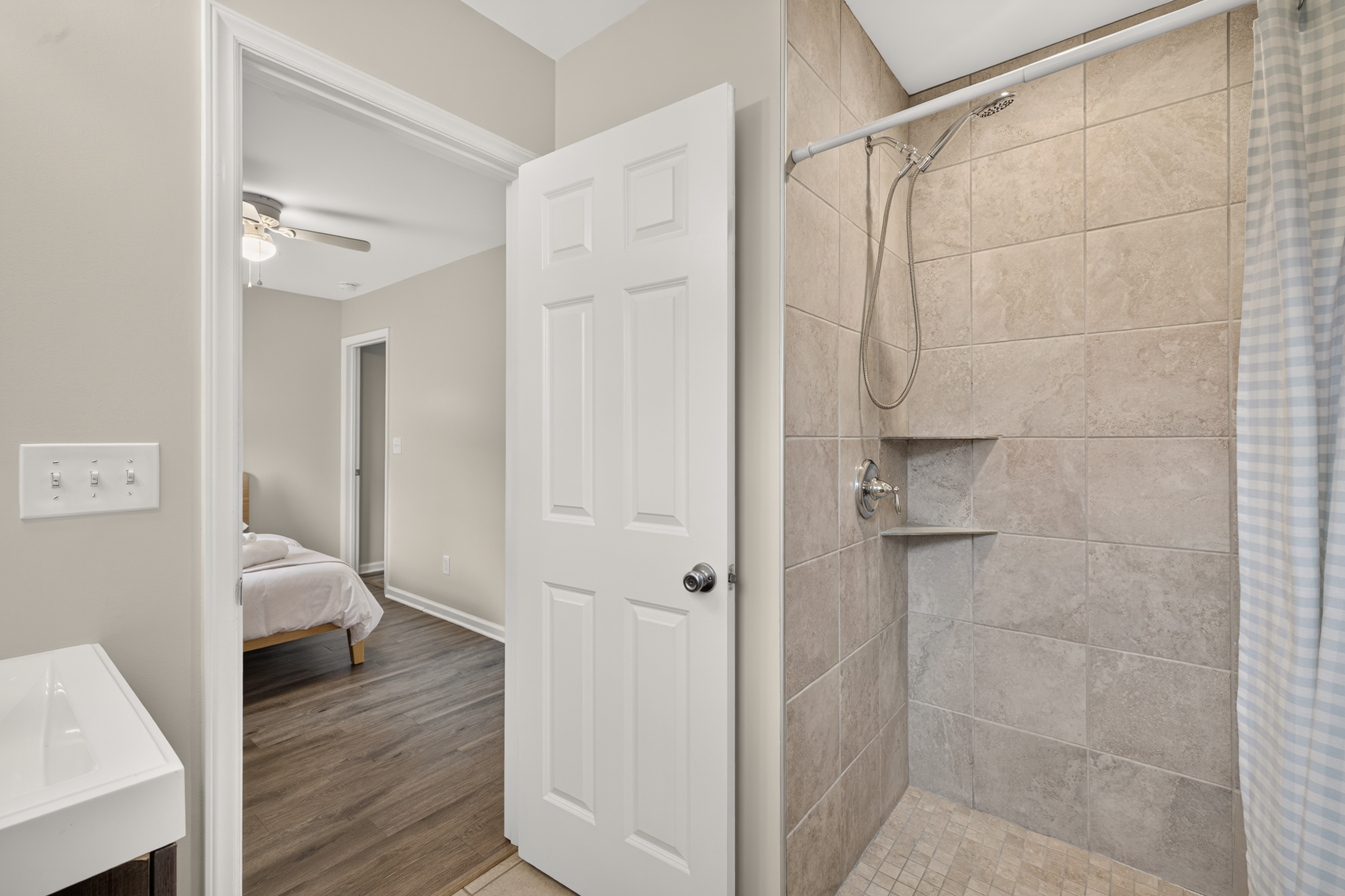 Primary en suite with a tiled walk-in shower