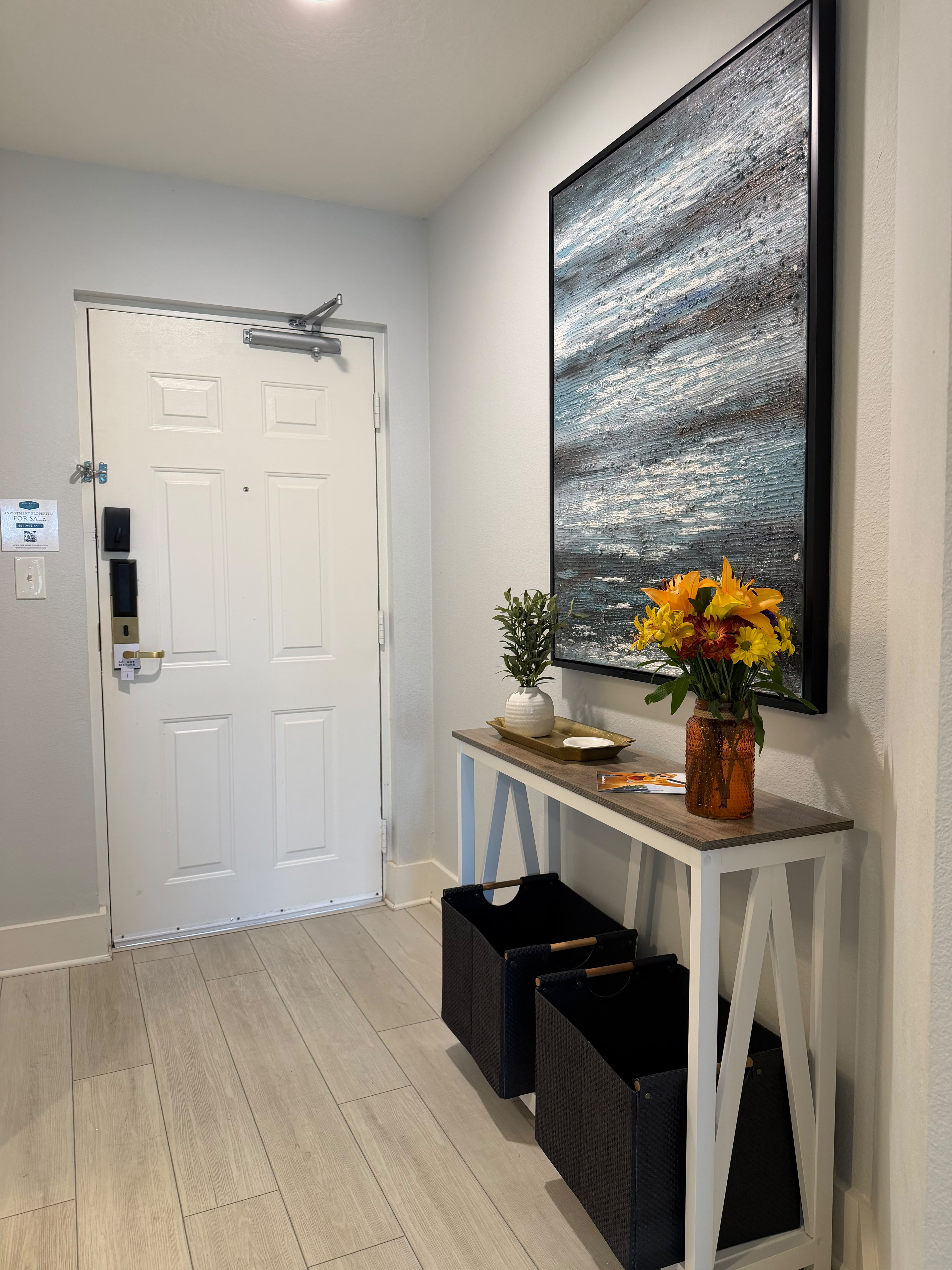 Bright, stylish entryway with smart lock and modern decor