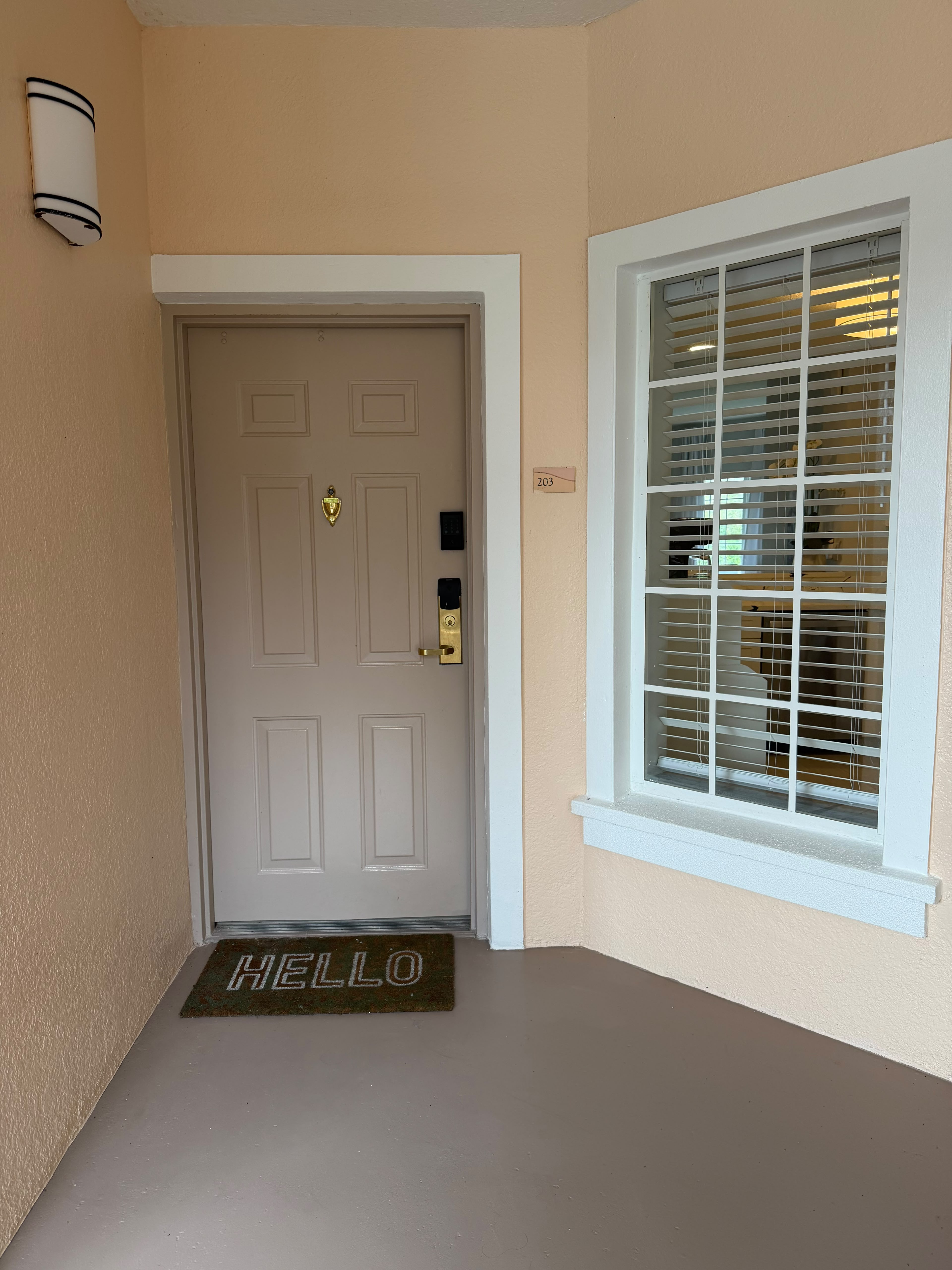 Welcoming private entry with keyless access and bright front window
