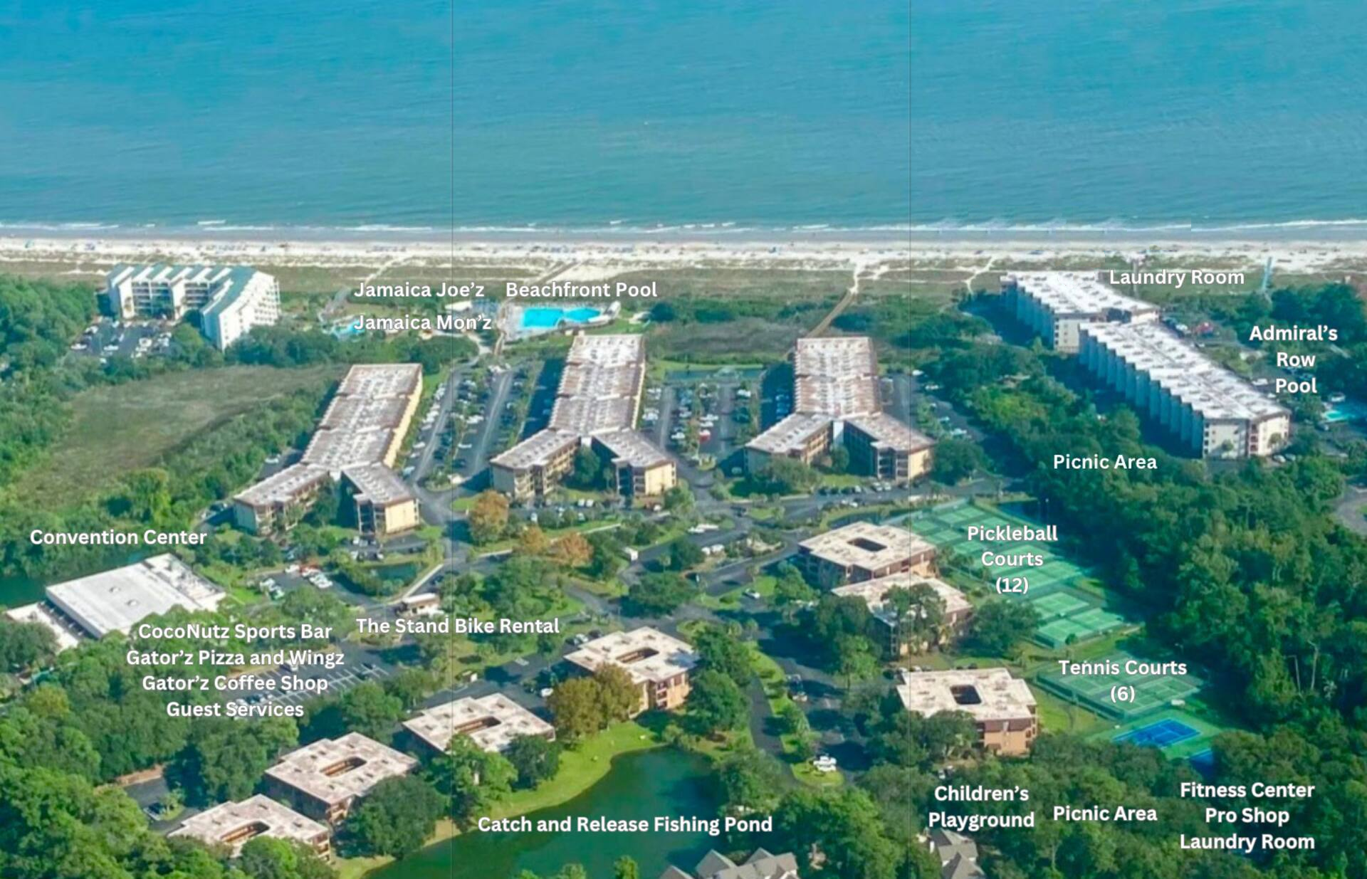 Aerial view of beachfront resort with pools, courts, dining, and beach access