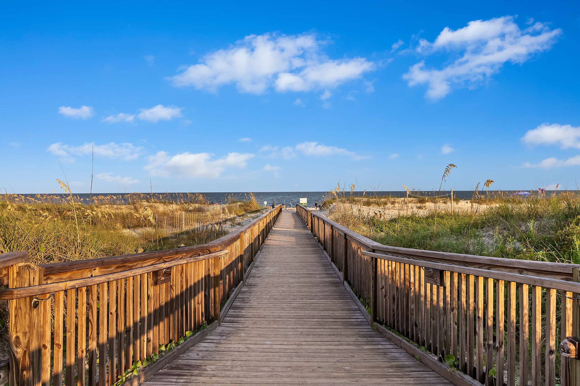 Scenic boardwalk through the dunes to a beautiful sandy beach