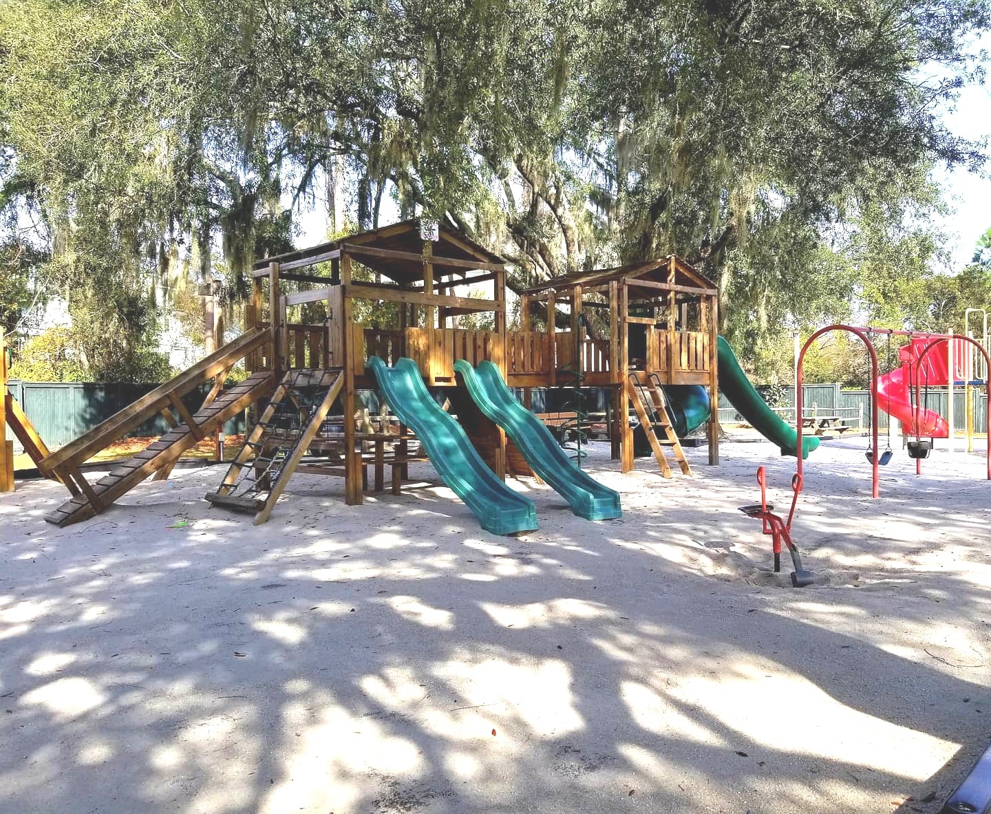 Shaded on-site playground with slides and space for family fun