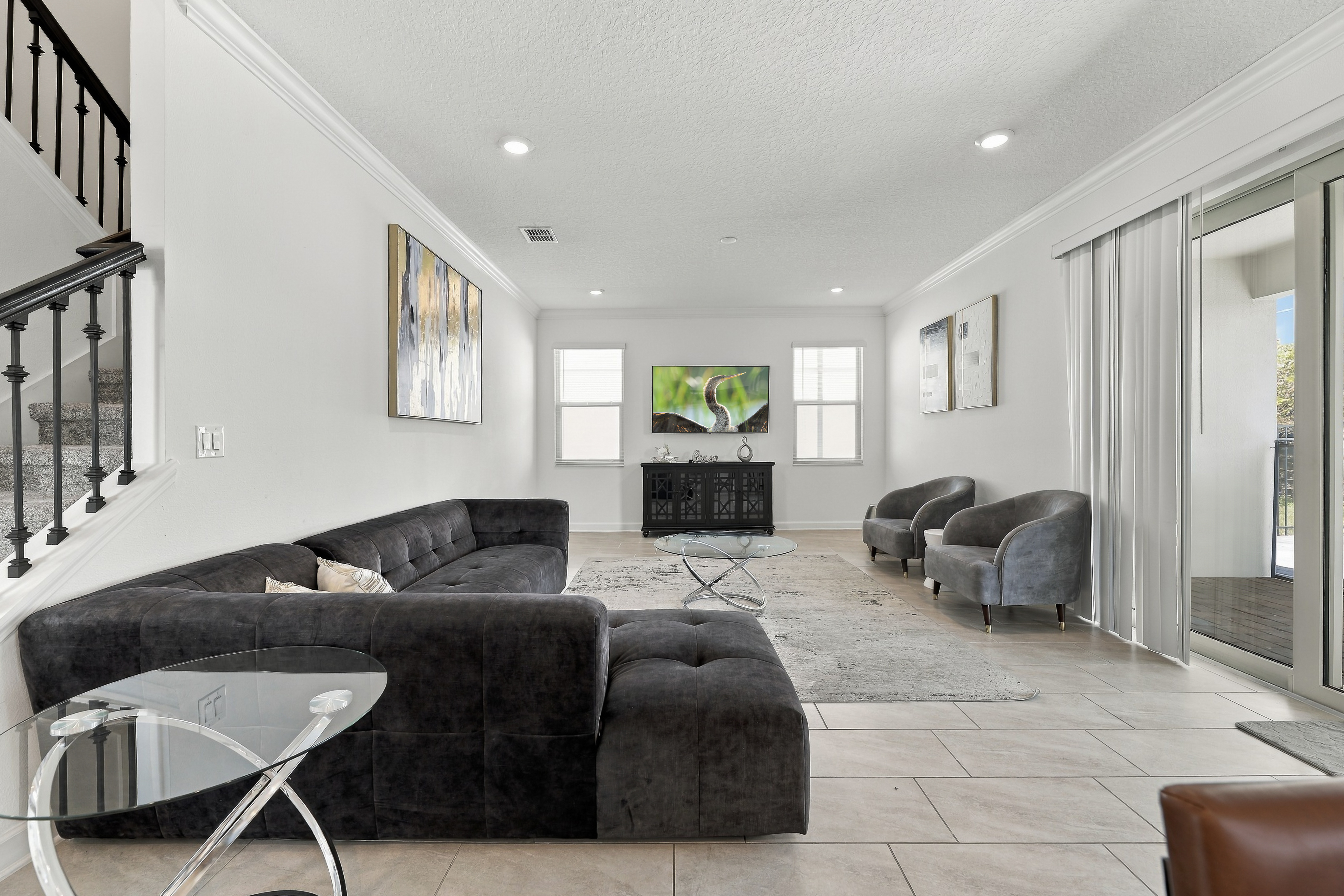 Bright modern living room with spacious seating and patio access