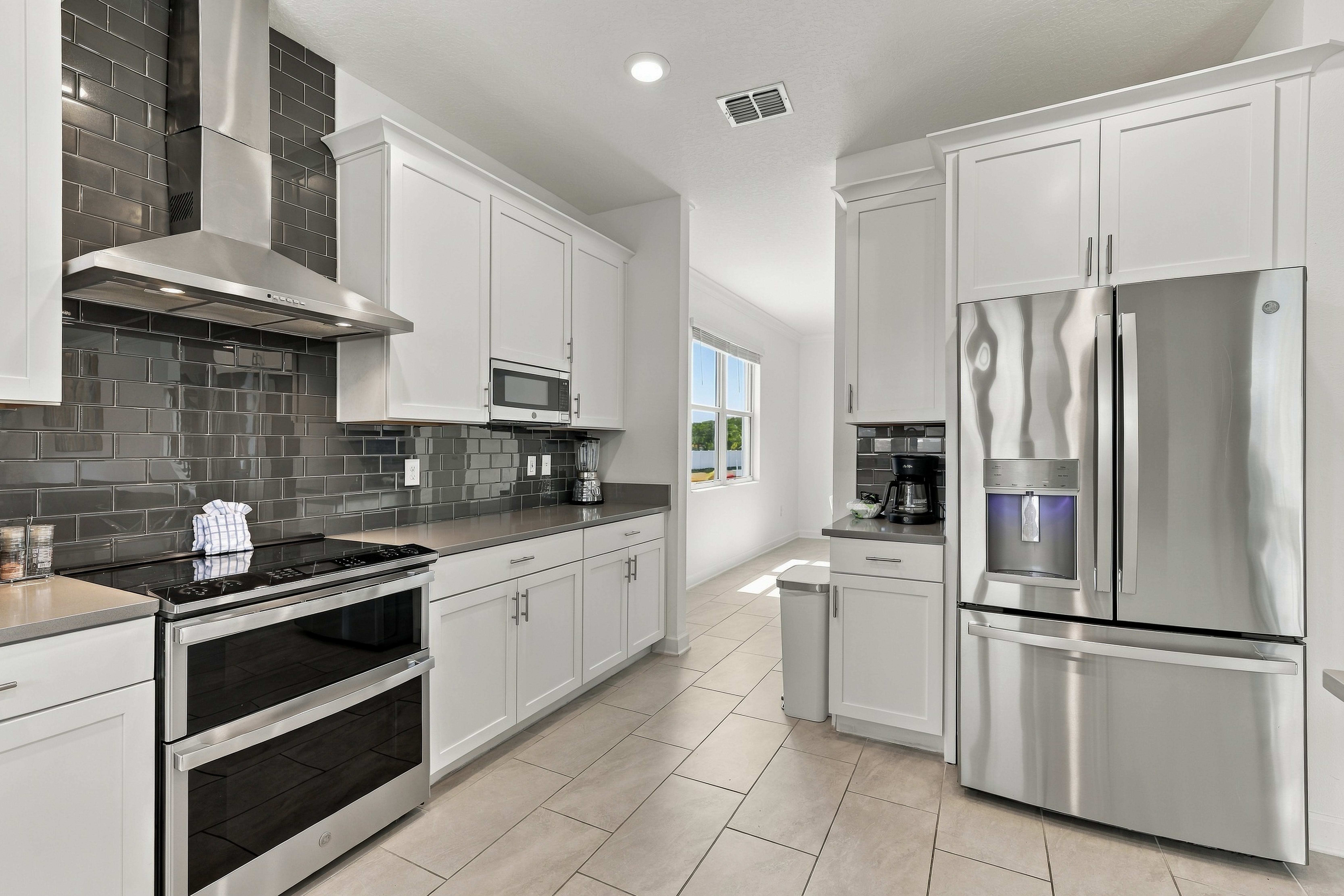 Bright modern kitchen with stainless appliances and sleek finishes
