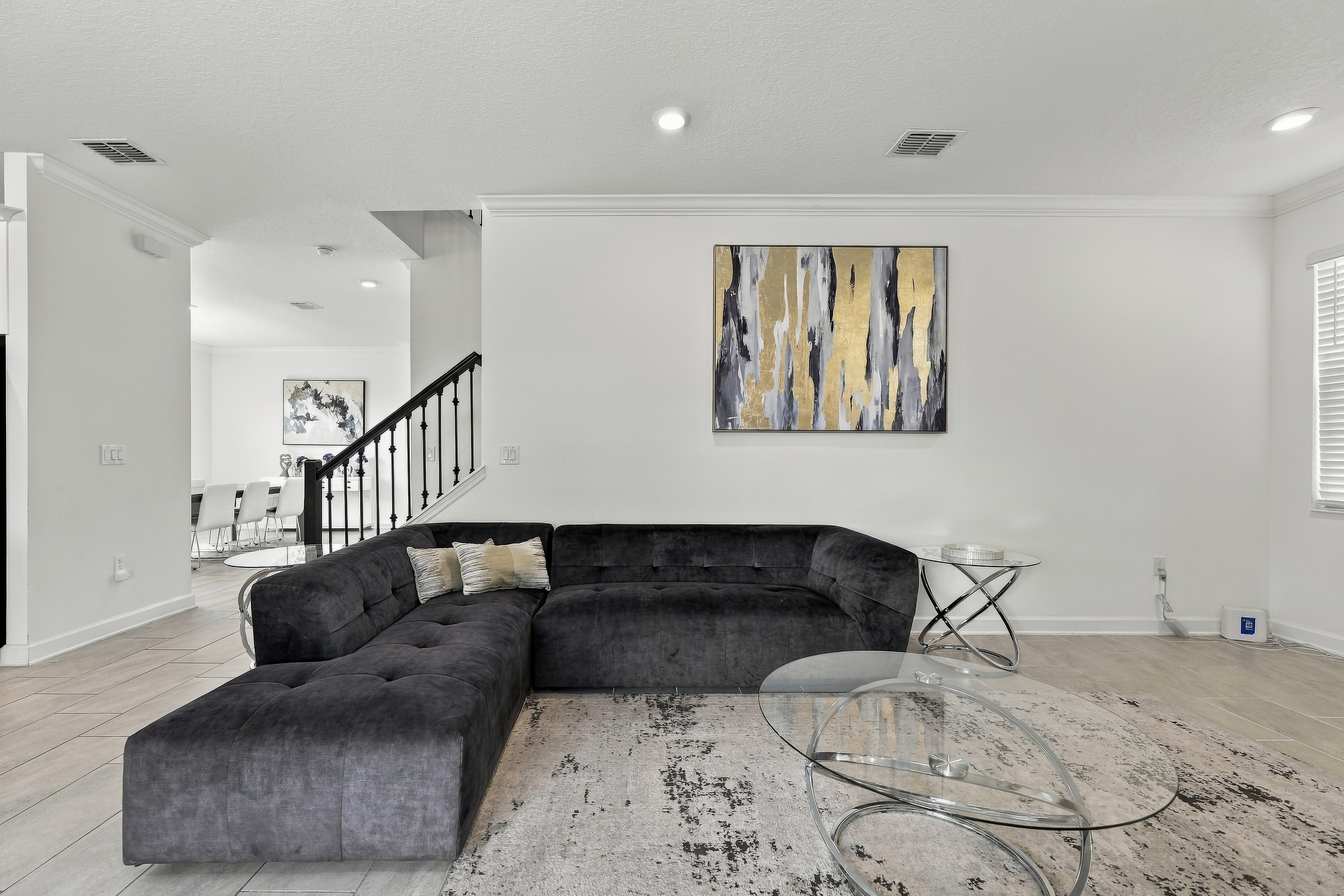 Bright modern lounge with plush sectional and stylish open layout