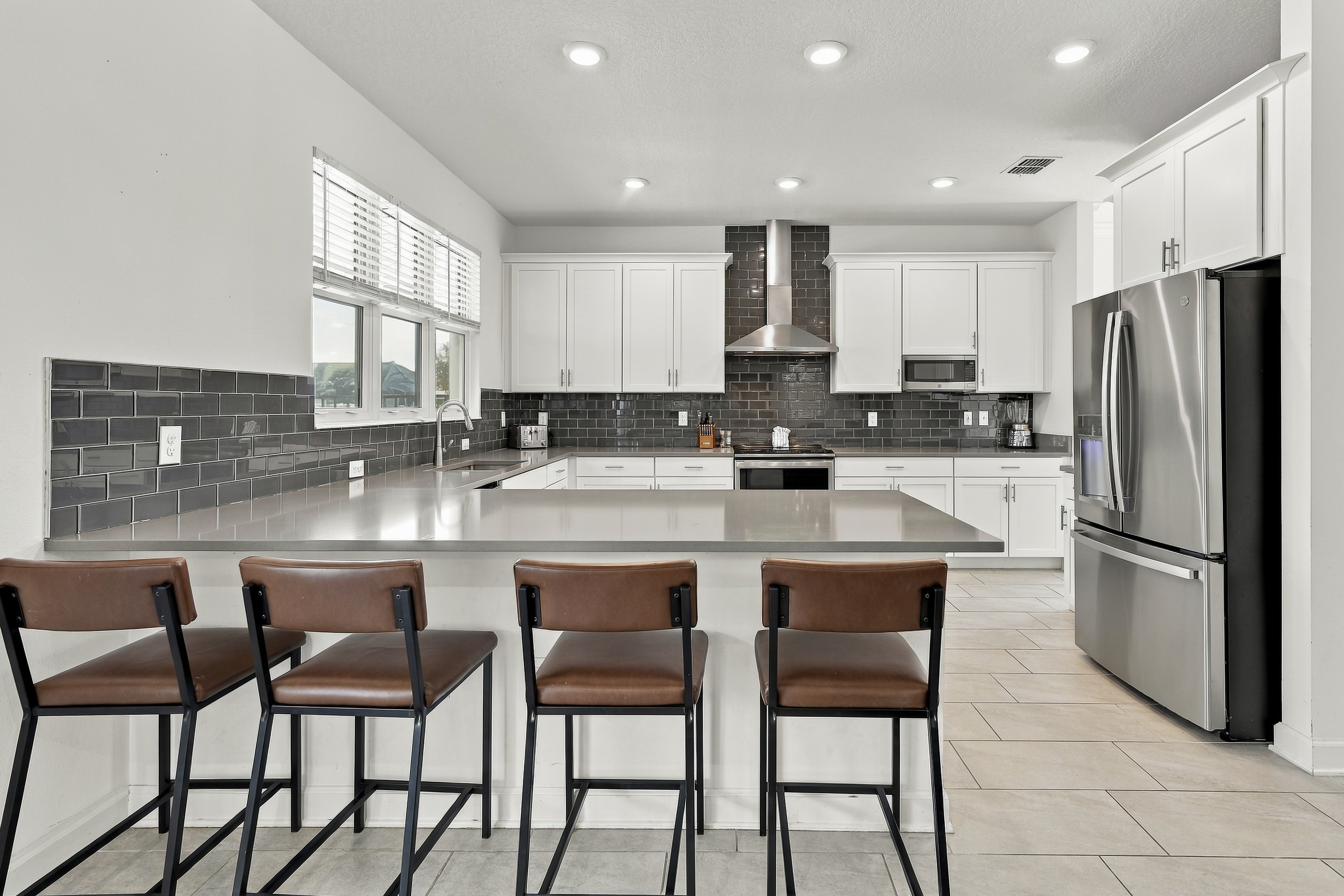 Bright modern kitchen with large island seating for four