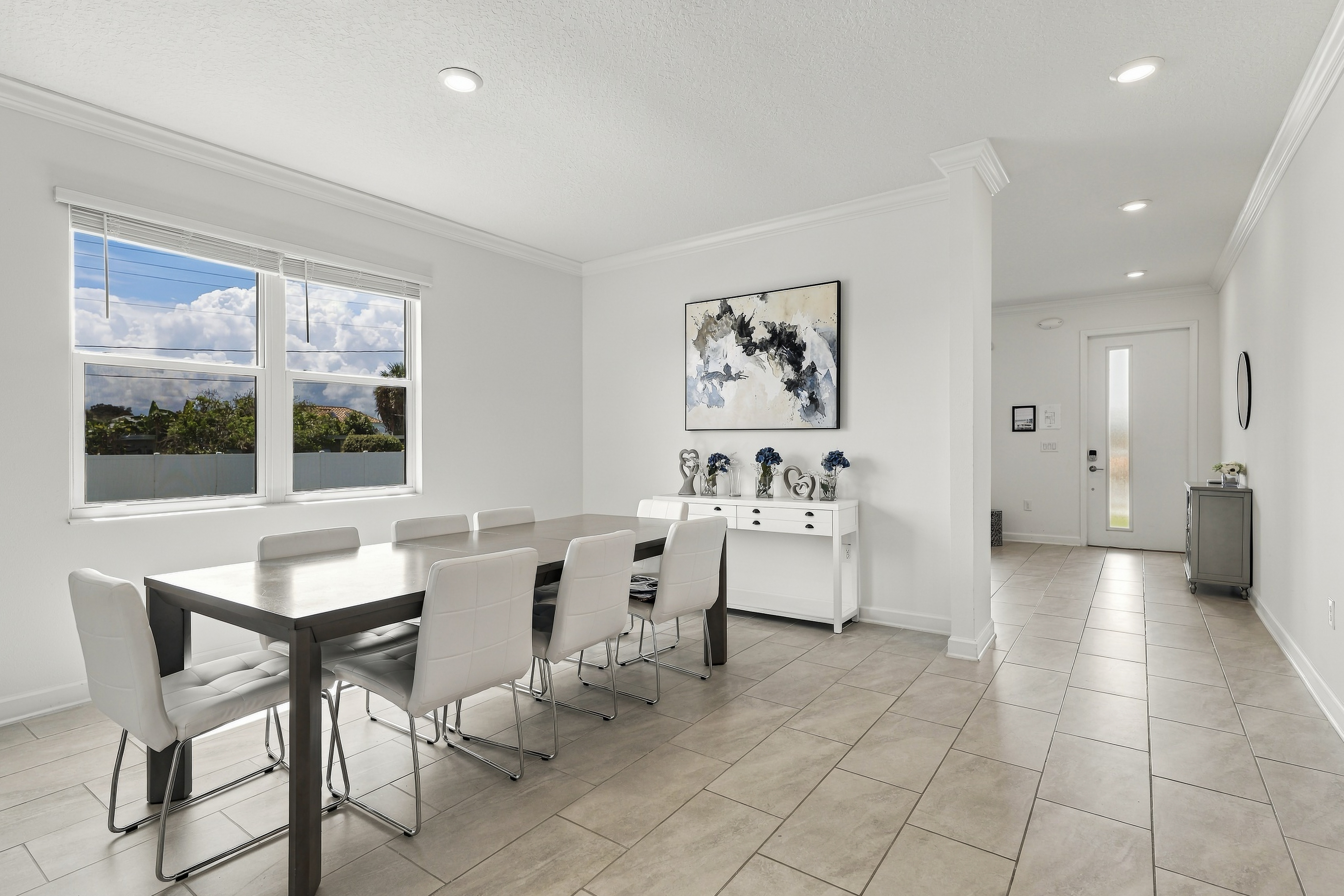 Bright modern dining area with seating for 6 and natural light