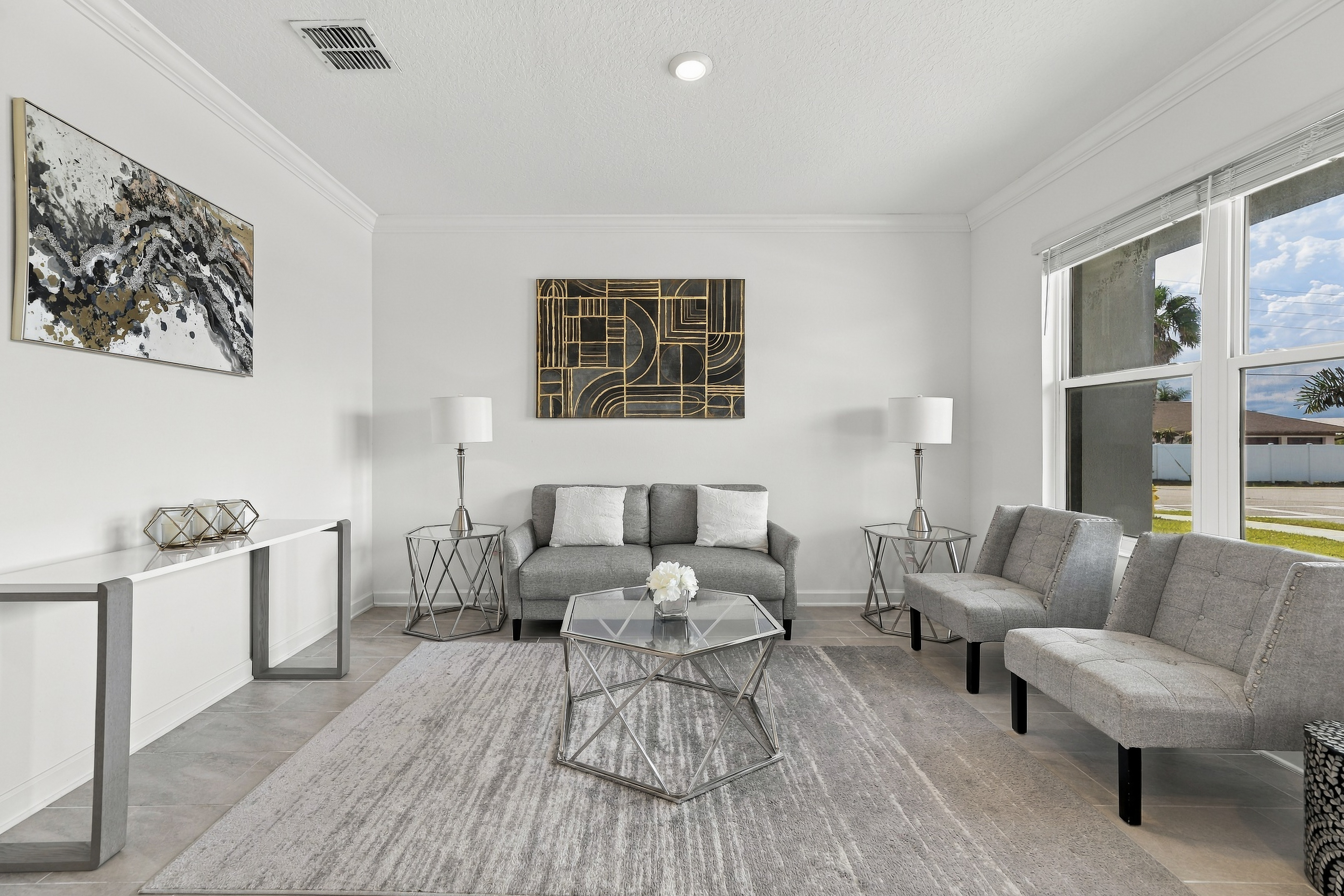 Bright modern living room with elegant seating and abundant natural light