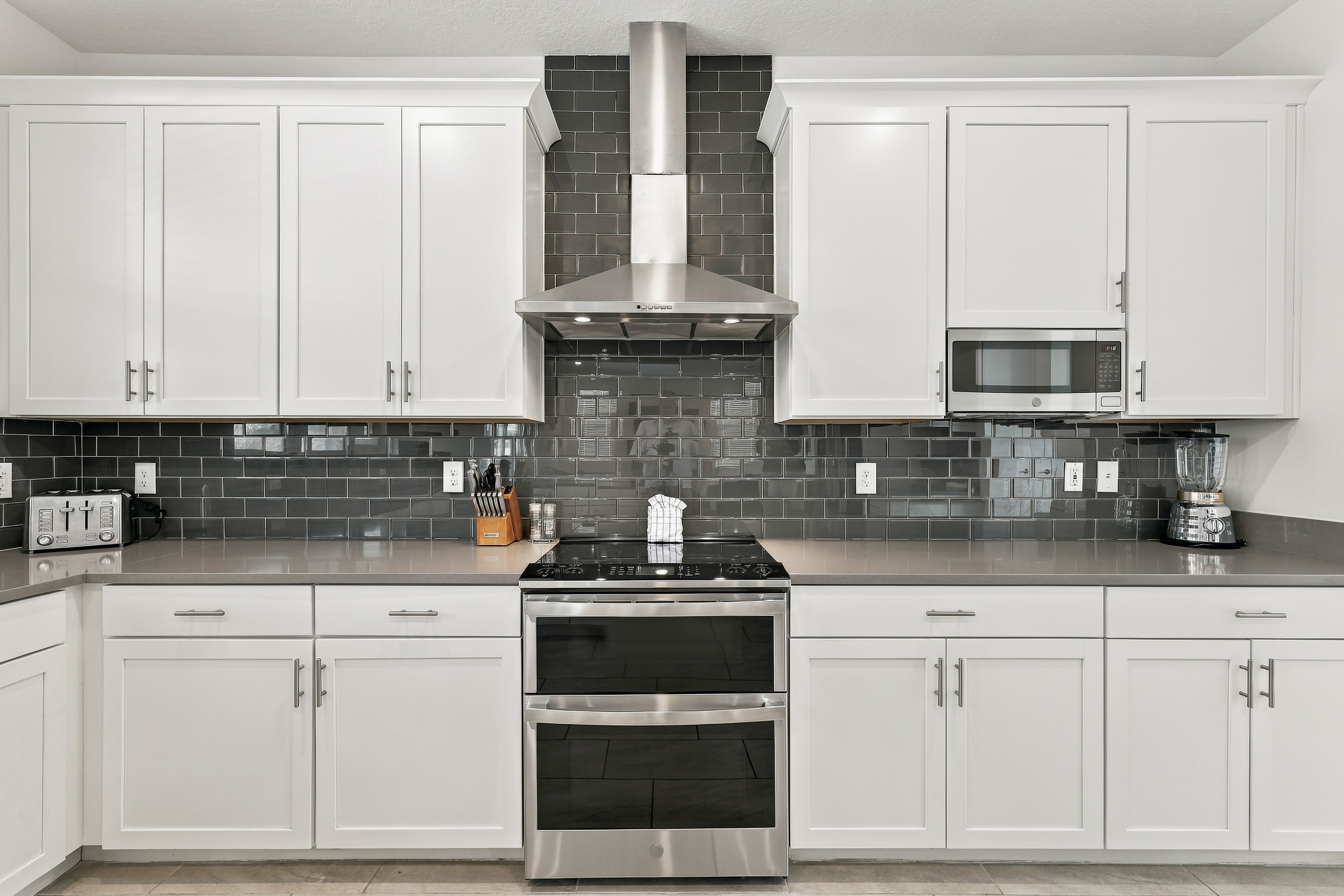 Modern chef’s kitchen with stainless appliances and sleek finishes