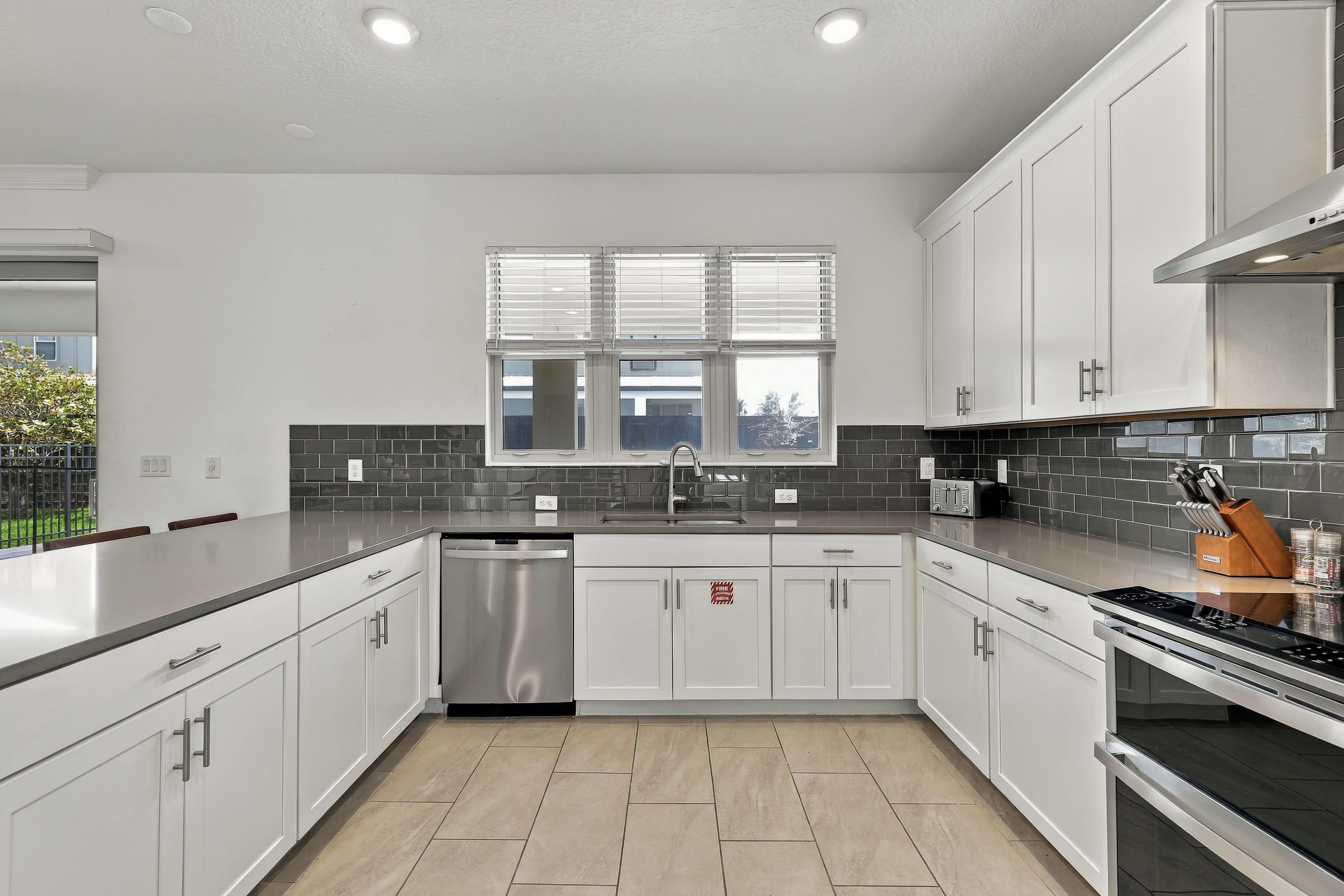 Bright modern kitchen with stainless appliances and ample counter space
