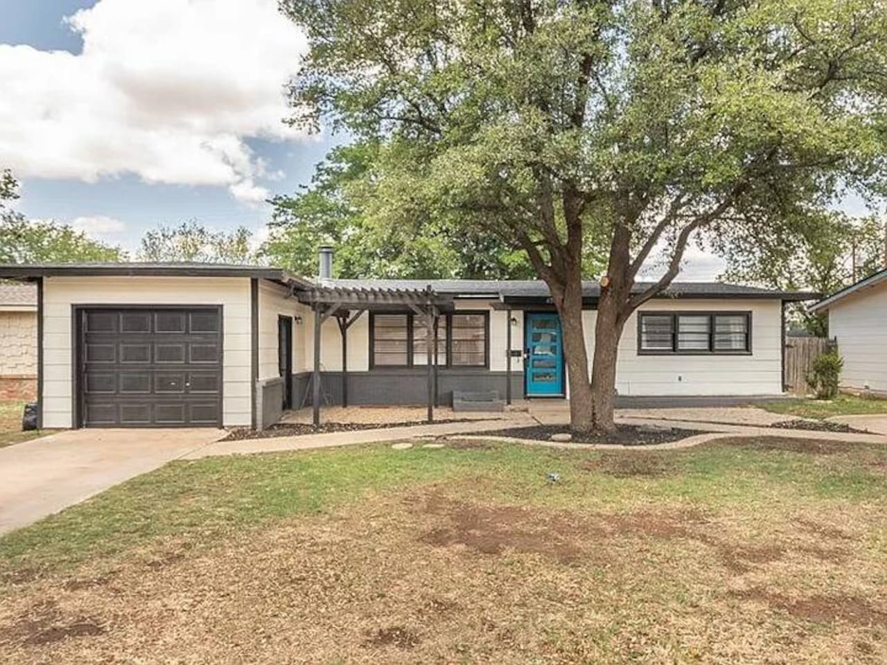 Quaint home with a pop of color! Enjoy a comfortable stay in this charming abode with a spacious yard.