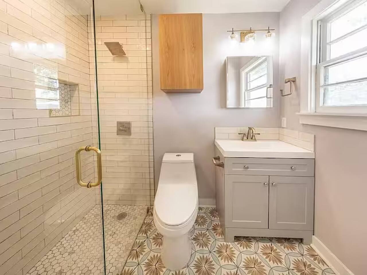Refresh in this stunning, spa-like bathroom! Featuring a sleek glass walk-in shower with designer tile, a modern vanity, and elegant gold accents, this bright and airy space offers the perfect blend of style and comfort.