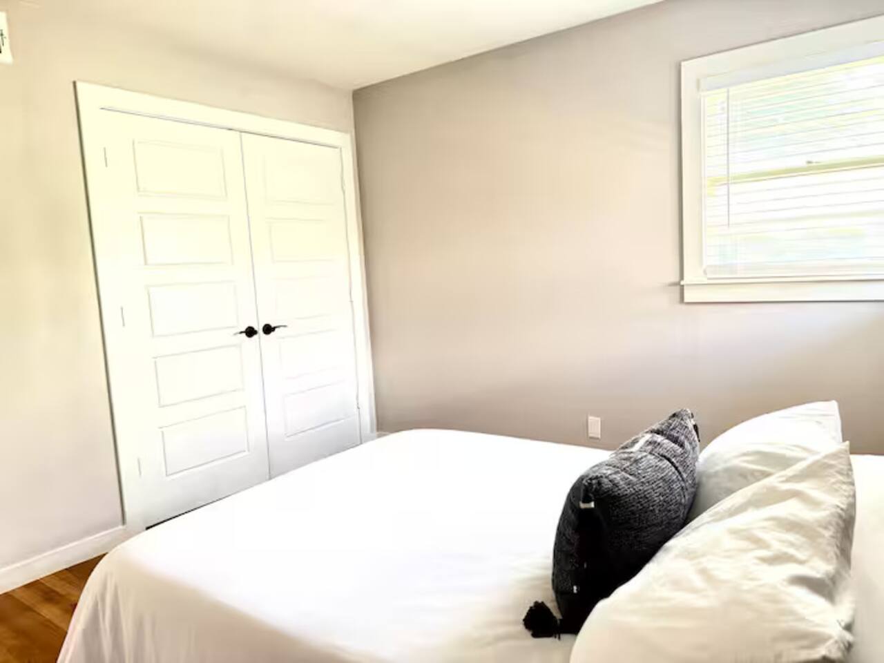 Relax in this peaceful, sun-drenched bedroom designed for both rest and productivity. Features include a plush bed, a dedicated work-from-home desk, and a smart TV for all your entertainment needs.