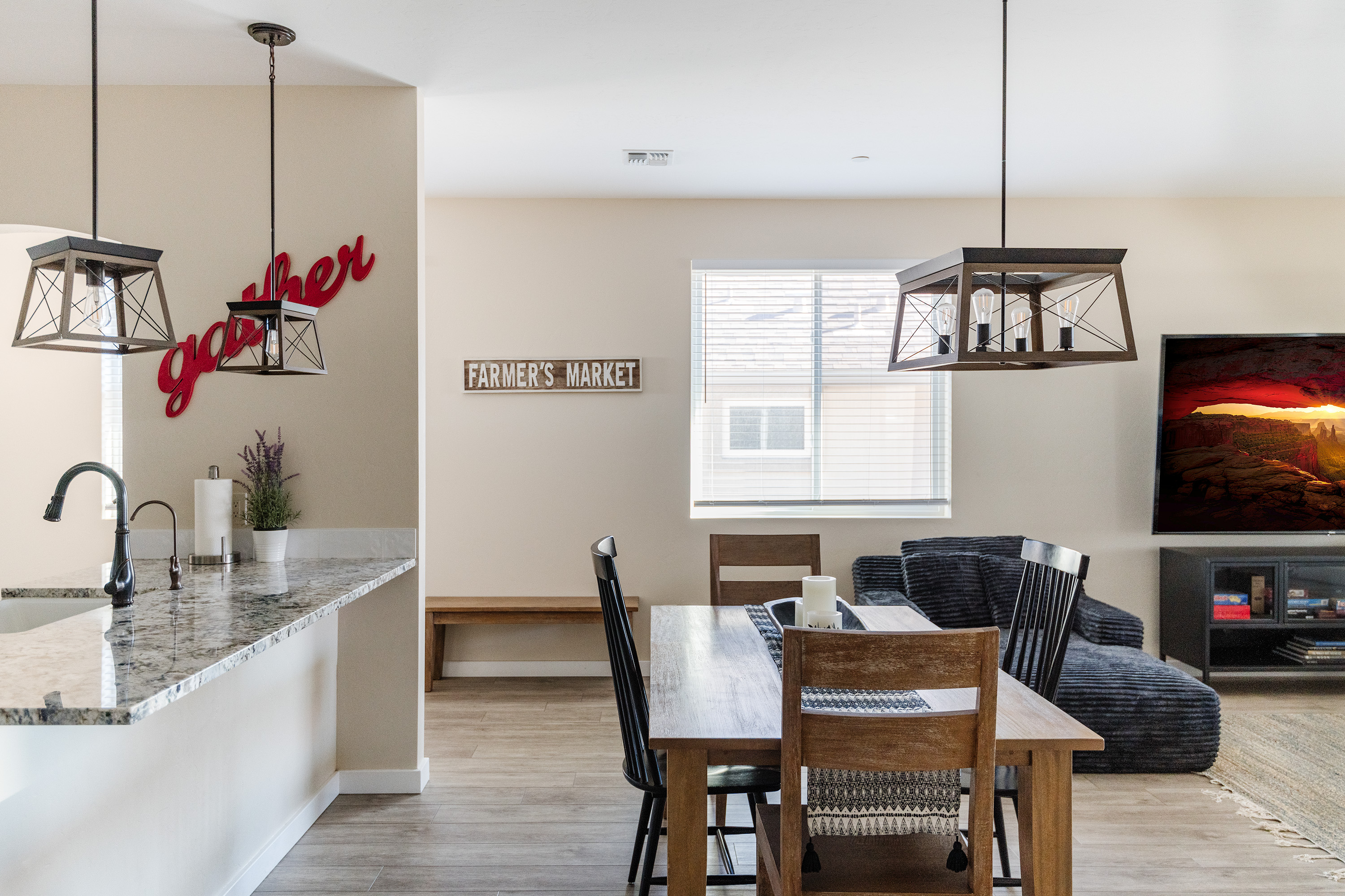 Bright open dining area with granite breakfast bar and cozy living space