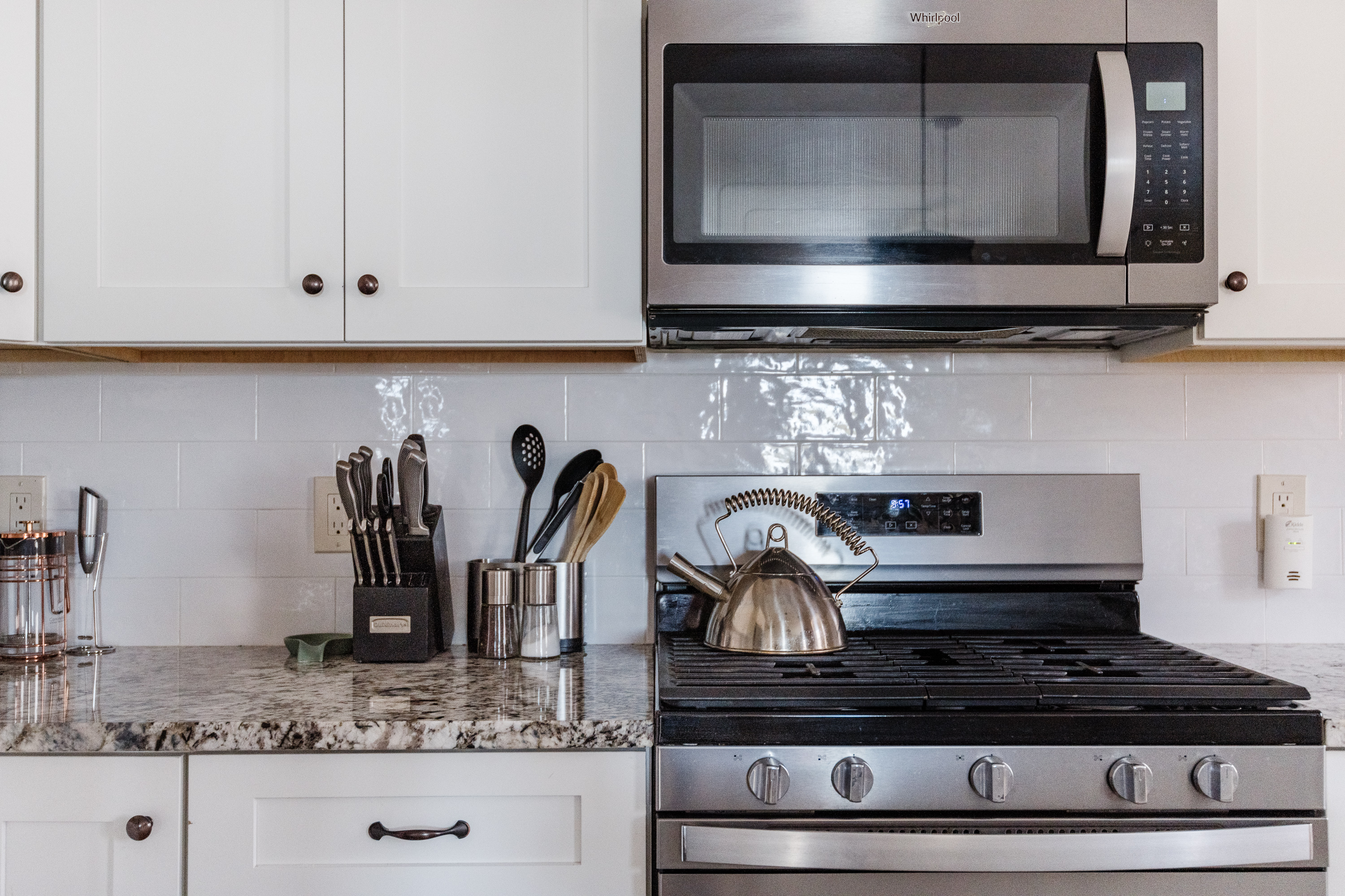 Modern kitchen with stainless appliances and granite countertops