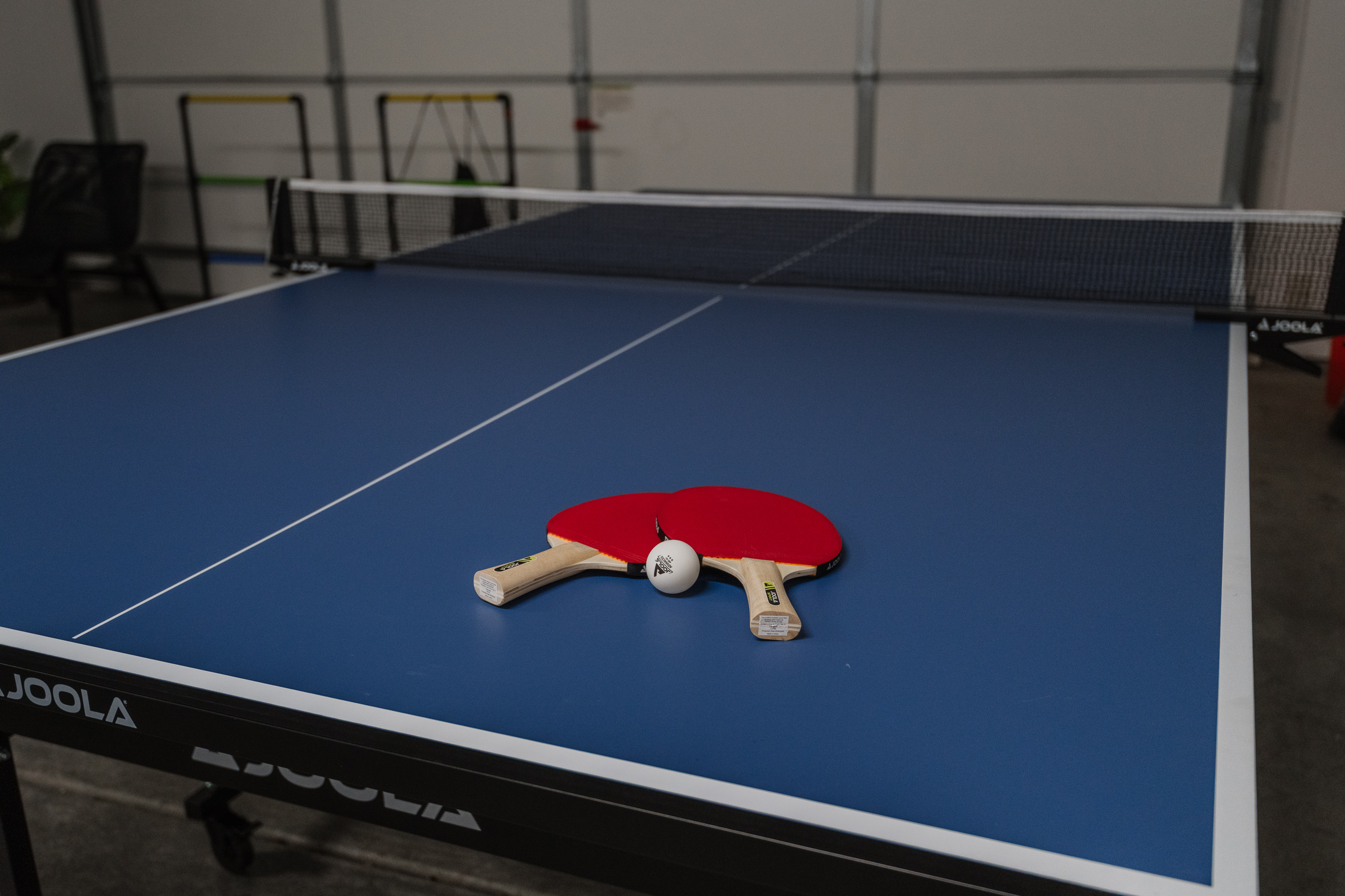 Garage game area with ping pong table for fun indoor entertainment