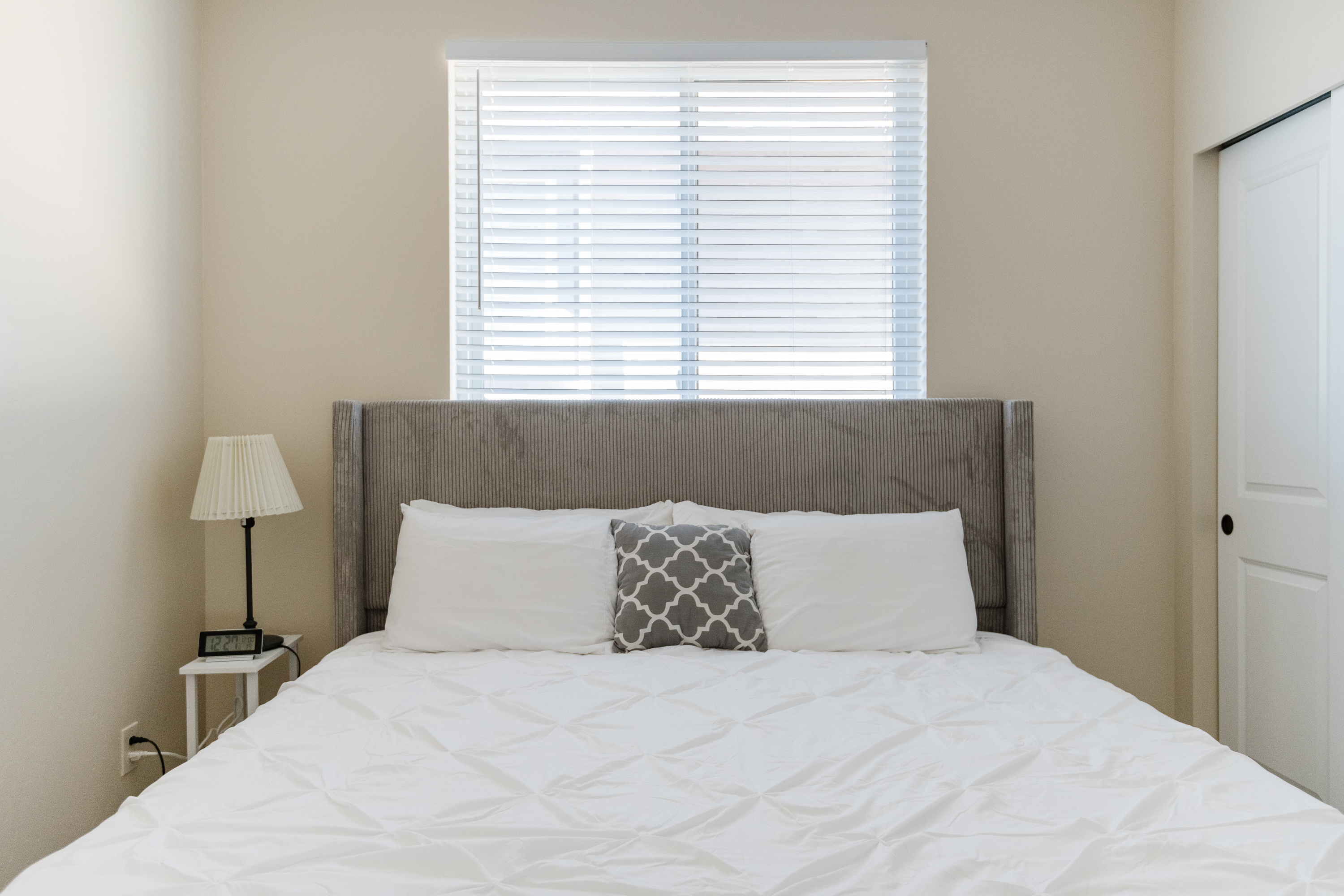 Bright, cozy bedroom with plush bedding and natural light