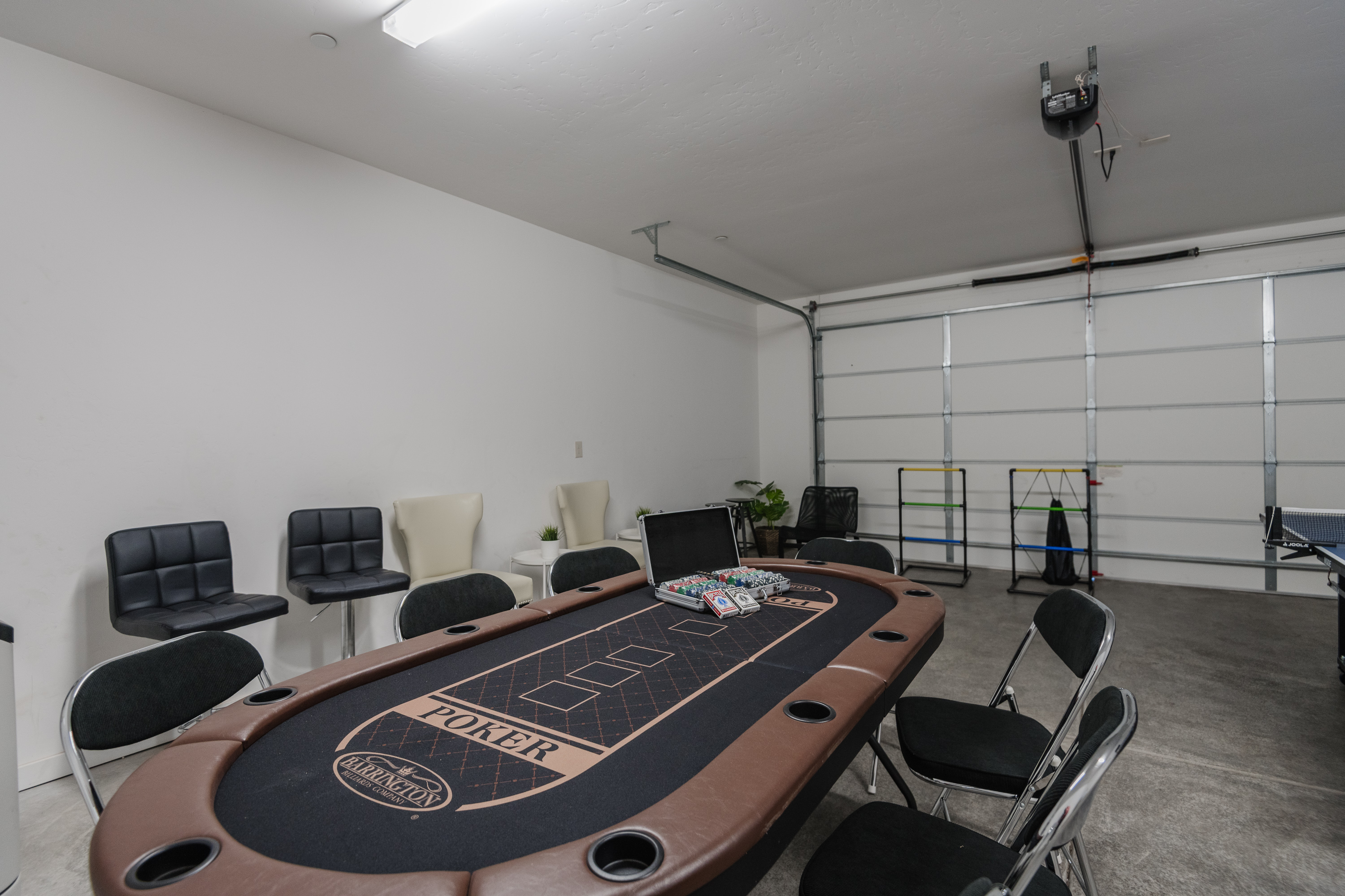 Private garage game room with poker table for fun group nights