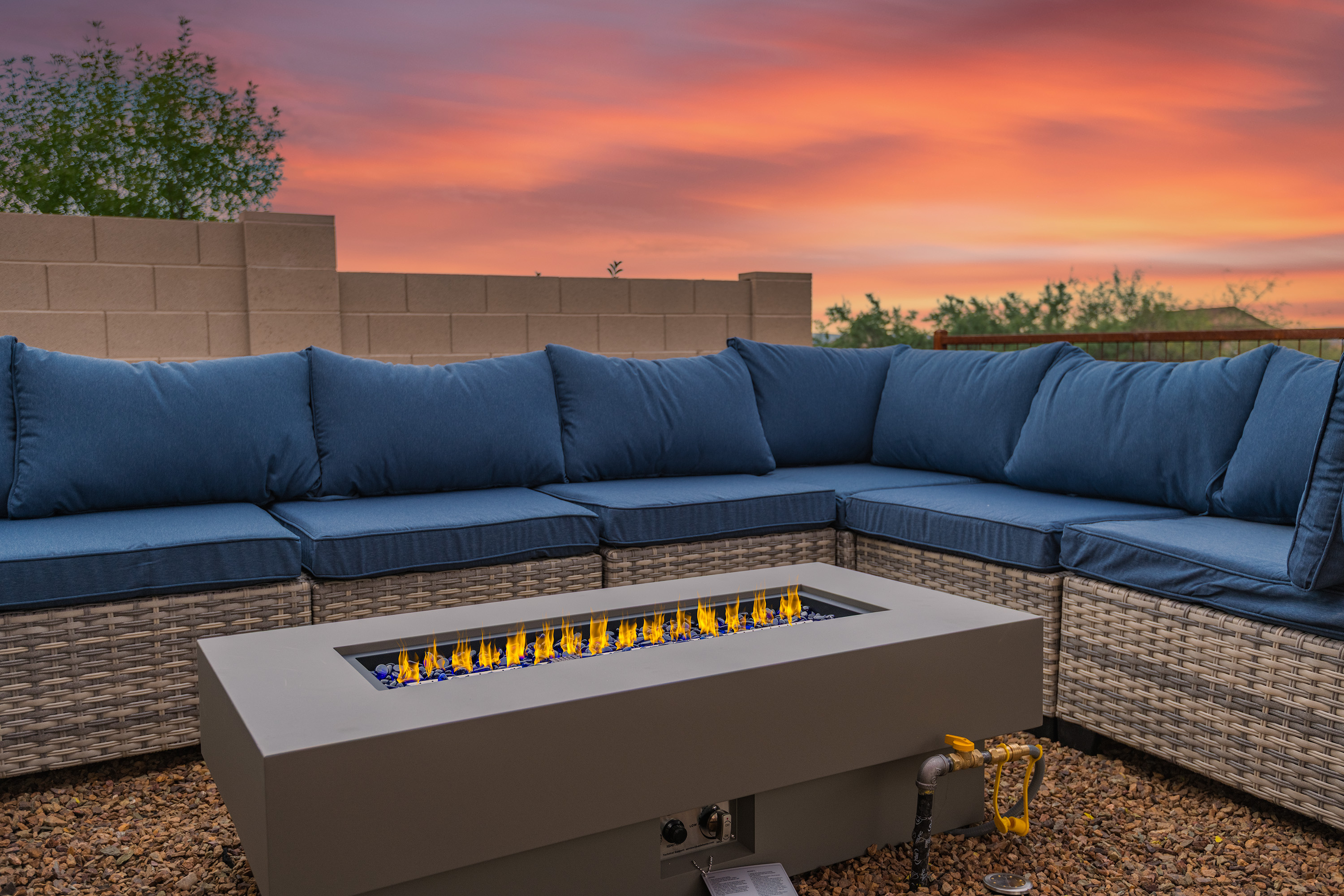 Cozy patio sectional with fire table and stunning sunset views