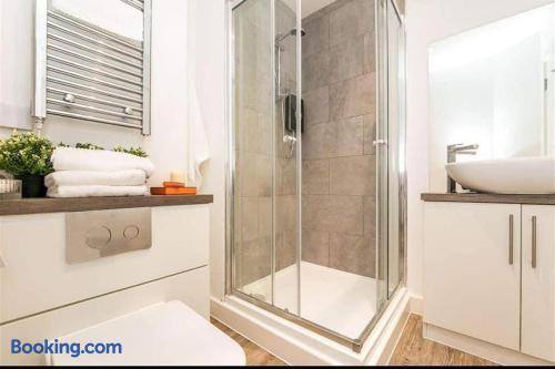 Bright modern bathroom with glass shower and heated towel rail