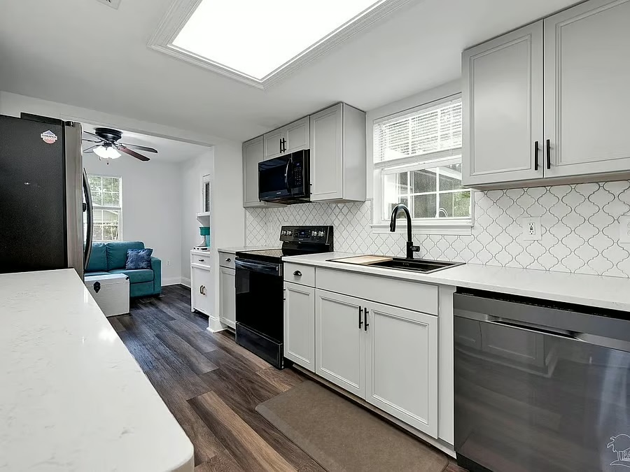 Bright modern kitchen with stainless appliances and stylish finishes