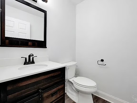 Bright modern bathroom with sleek vanity, bold finishes, and a clean design