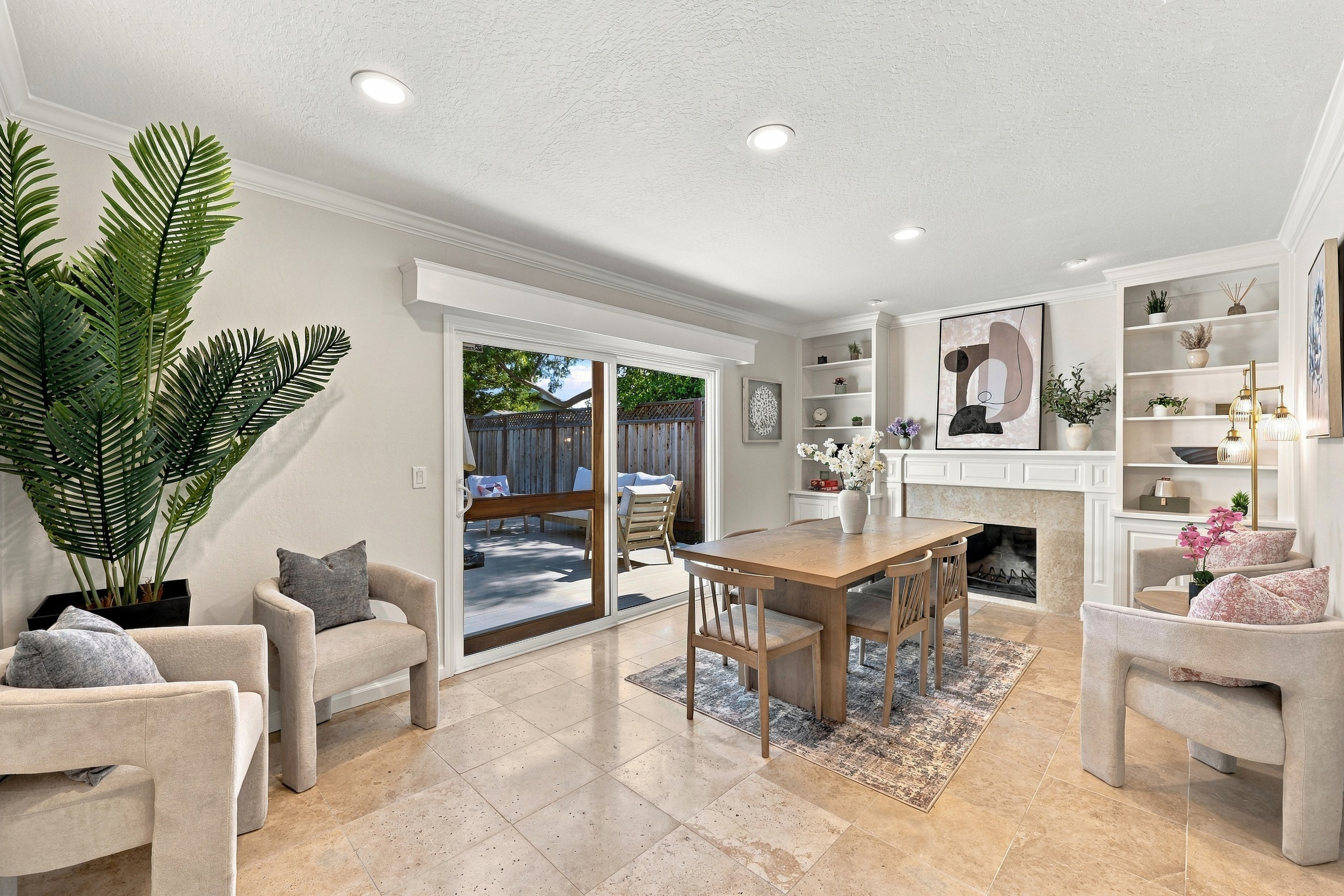 Bright dining area with fireplace and patio access