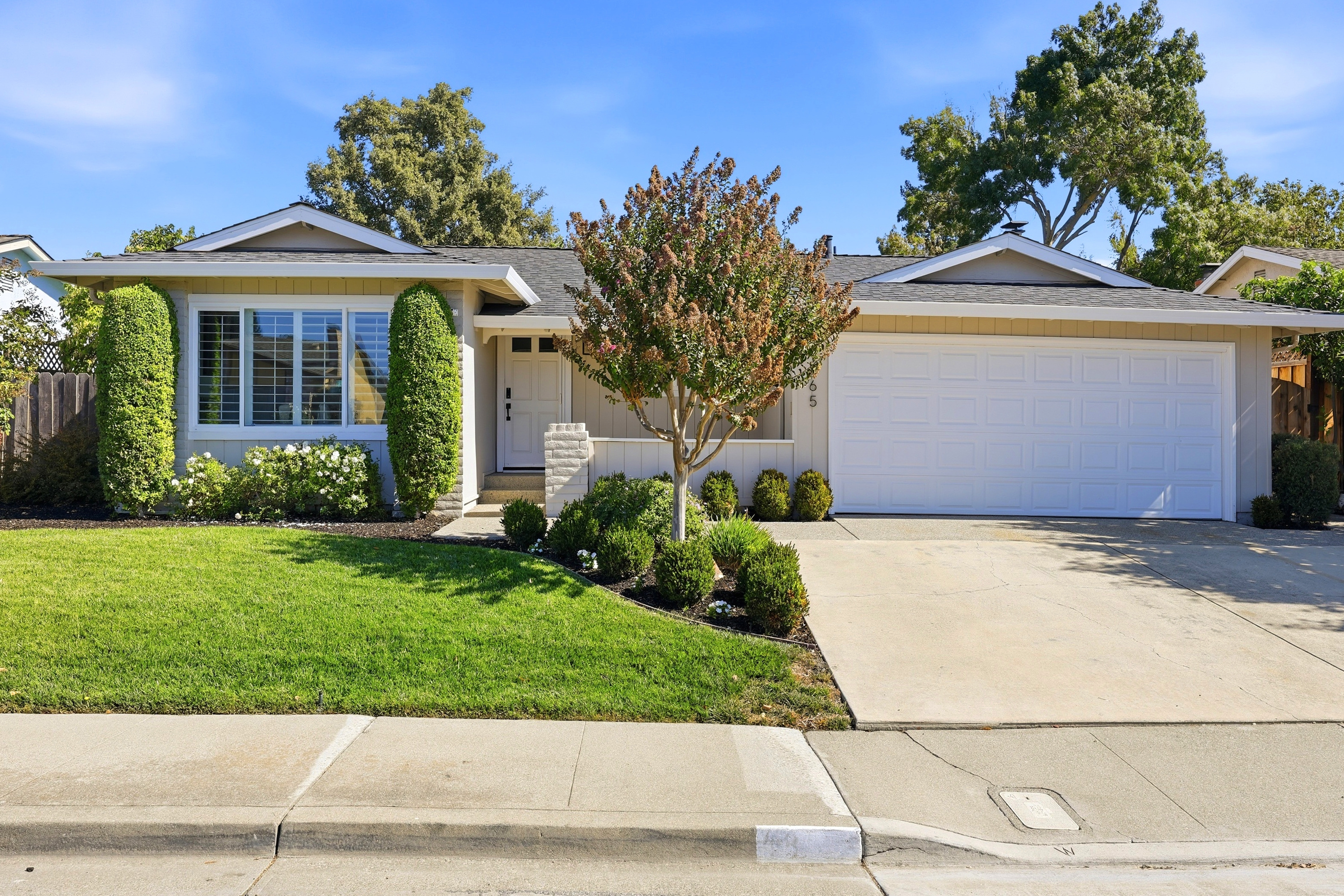 Charming single-story home with lush landscaping and great curb appeal