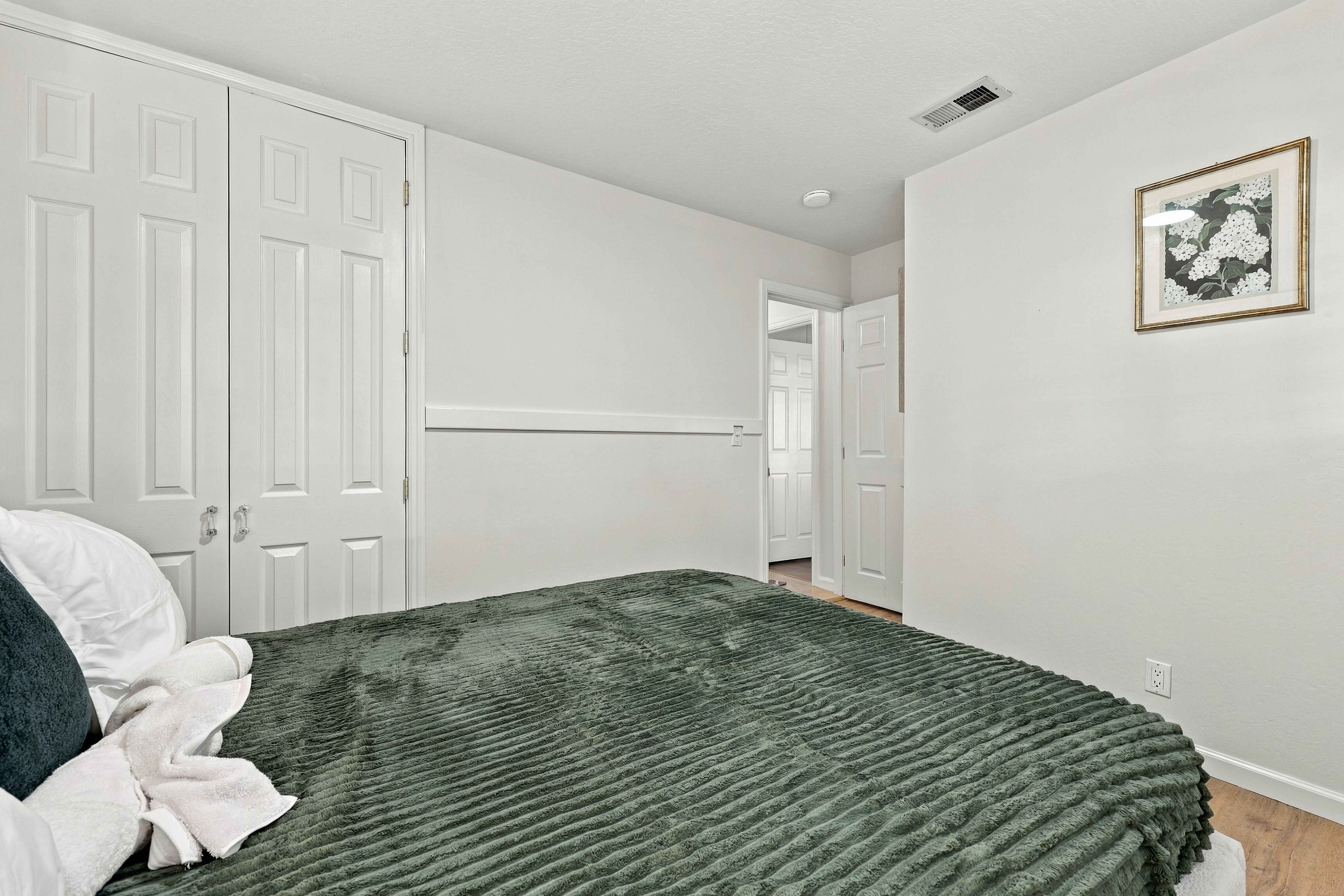 Cozy bedroom with plush bedding and a spacious closet