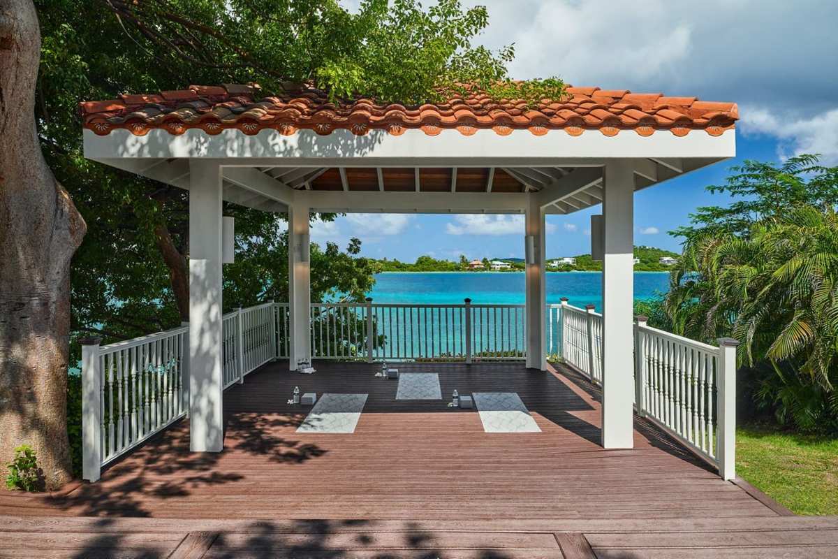Covered waterfront pavilion with turquoise views—perfect for yoga or lounging