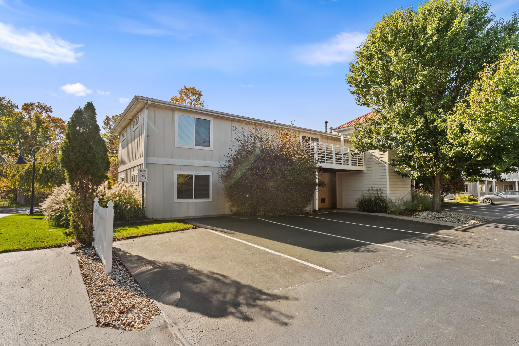 Convenient off-street parking with a bright, tree-lined exterior setting