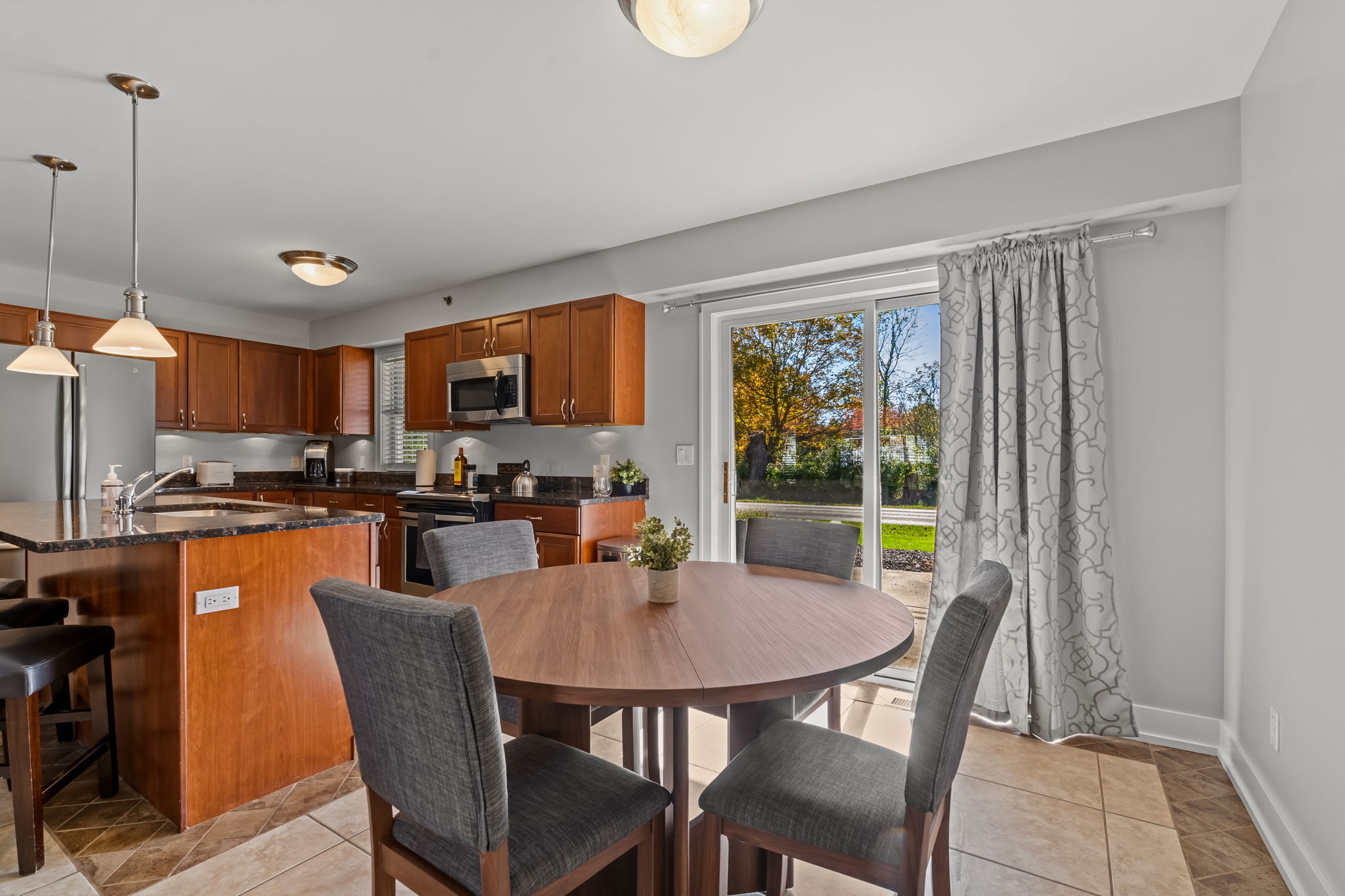 Bright eat-in kitchen with patio access and seating for four