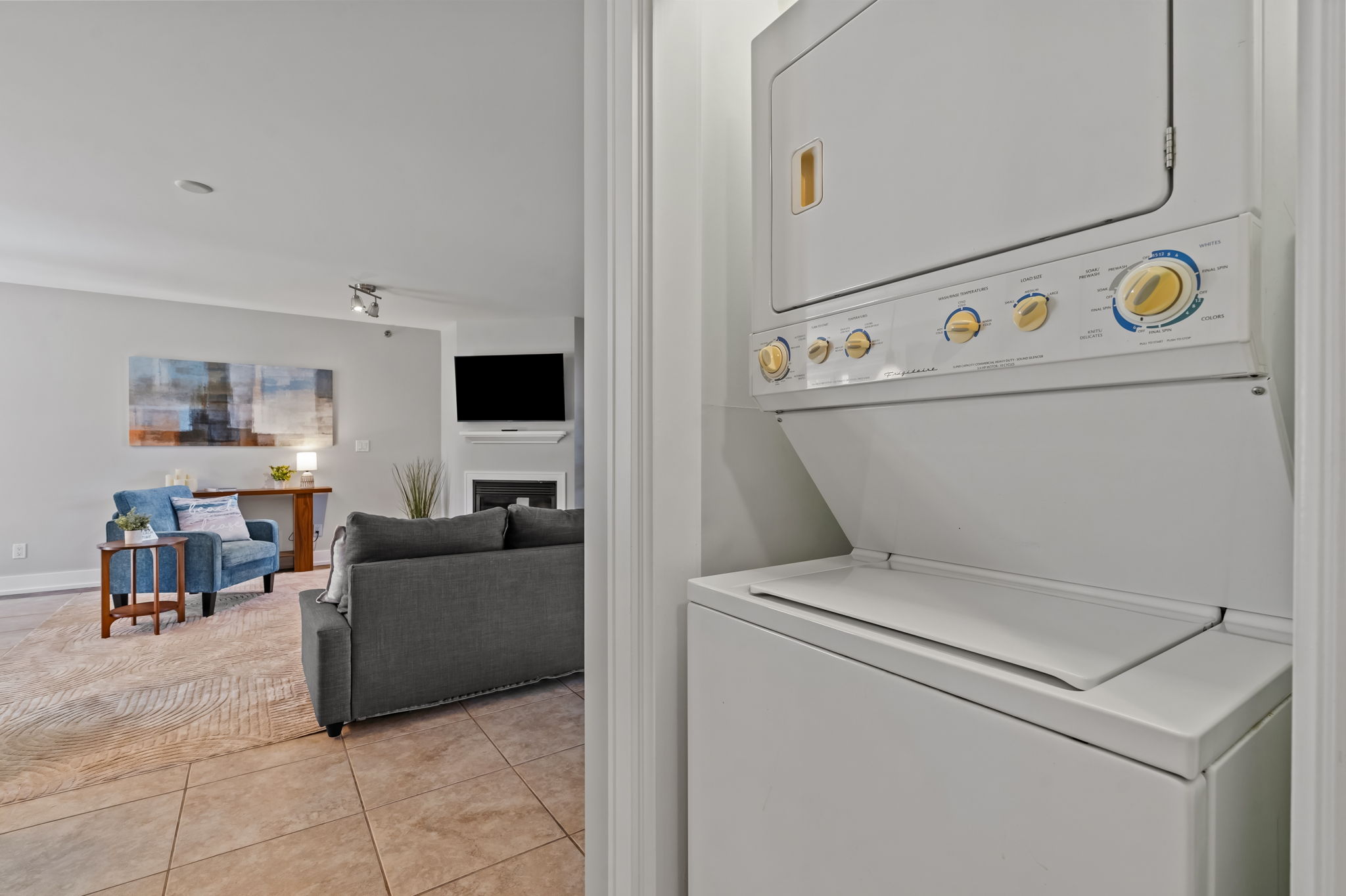 In-unit washer/dryer beside a bright, cozy living space