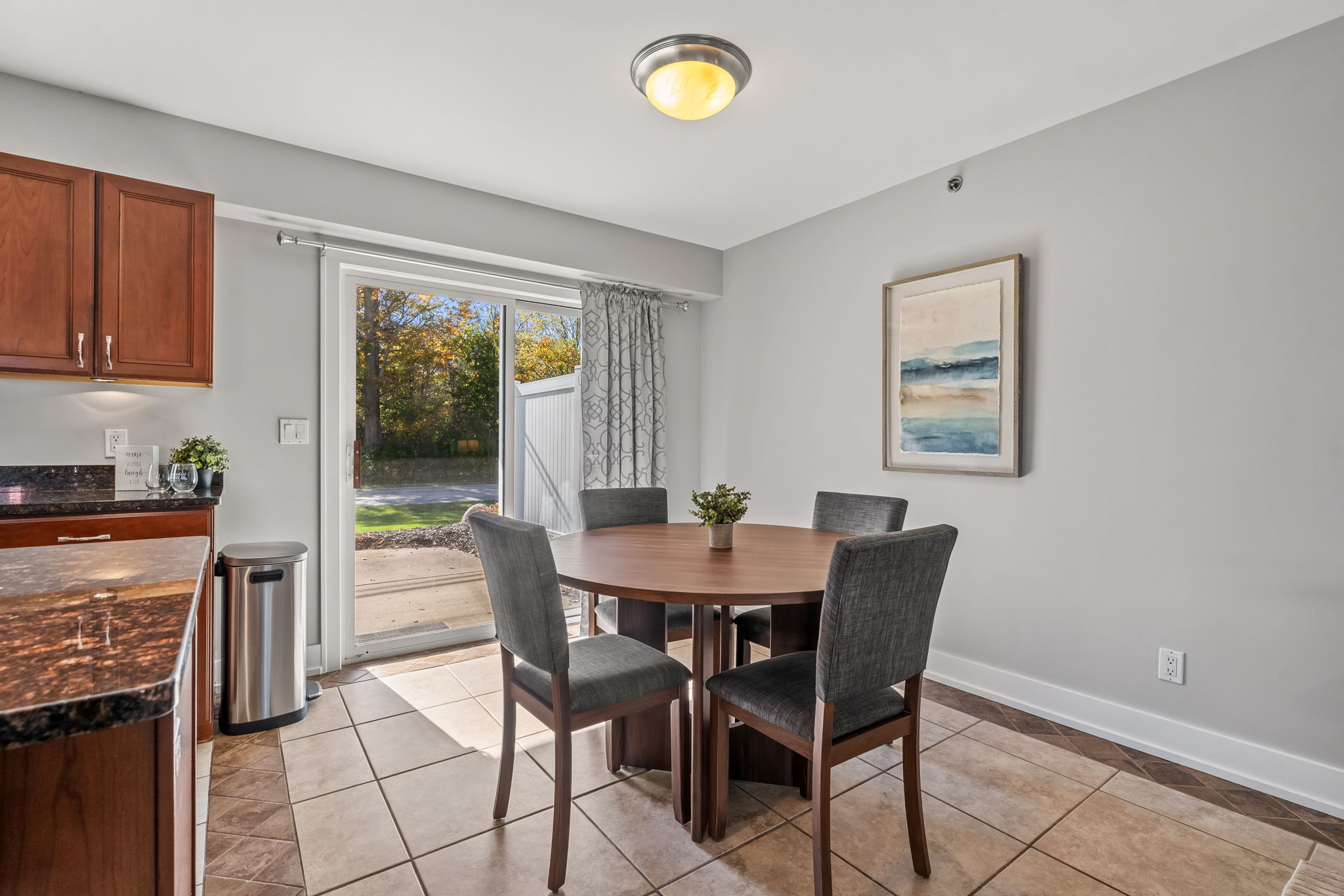 Sunny dining nook for four with patio access and natural light