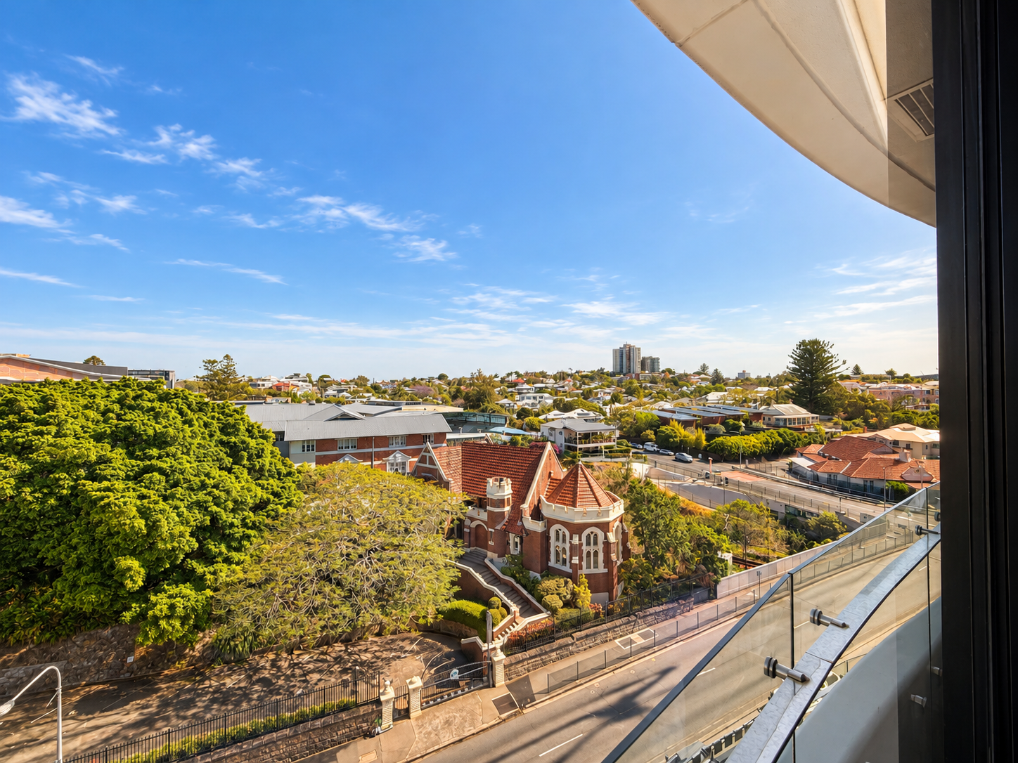 Private balcony with sweeping neighborhood views and sunny skyline